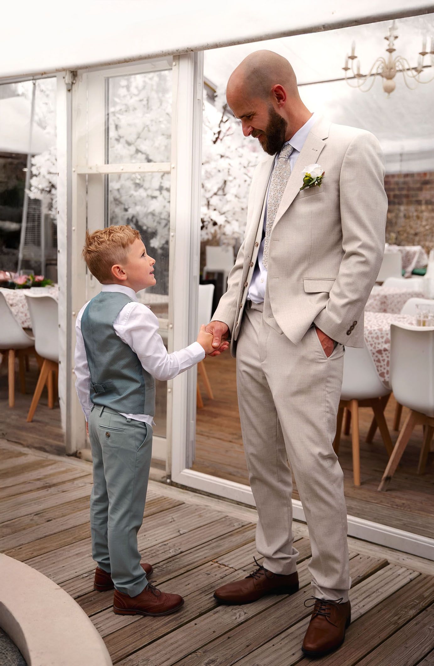 Sweet moment captured on a wooden deck outdoors.