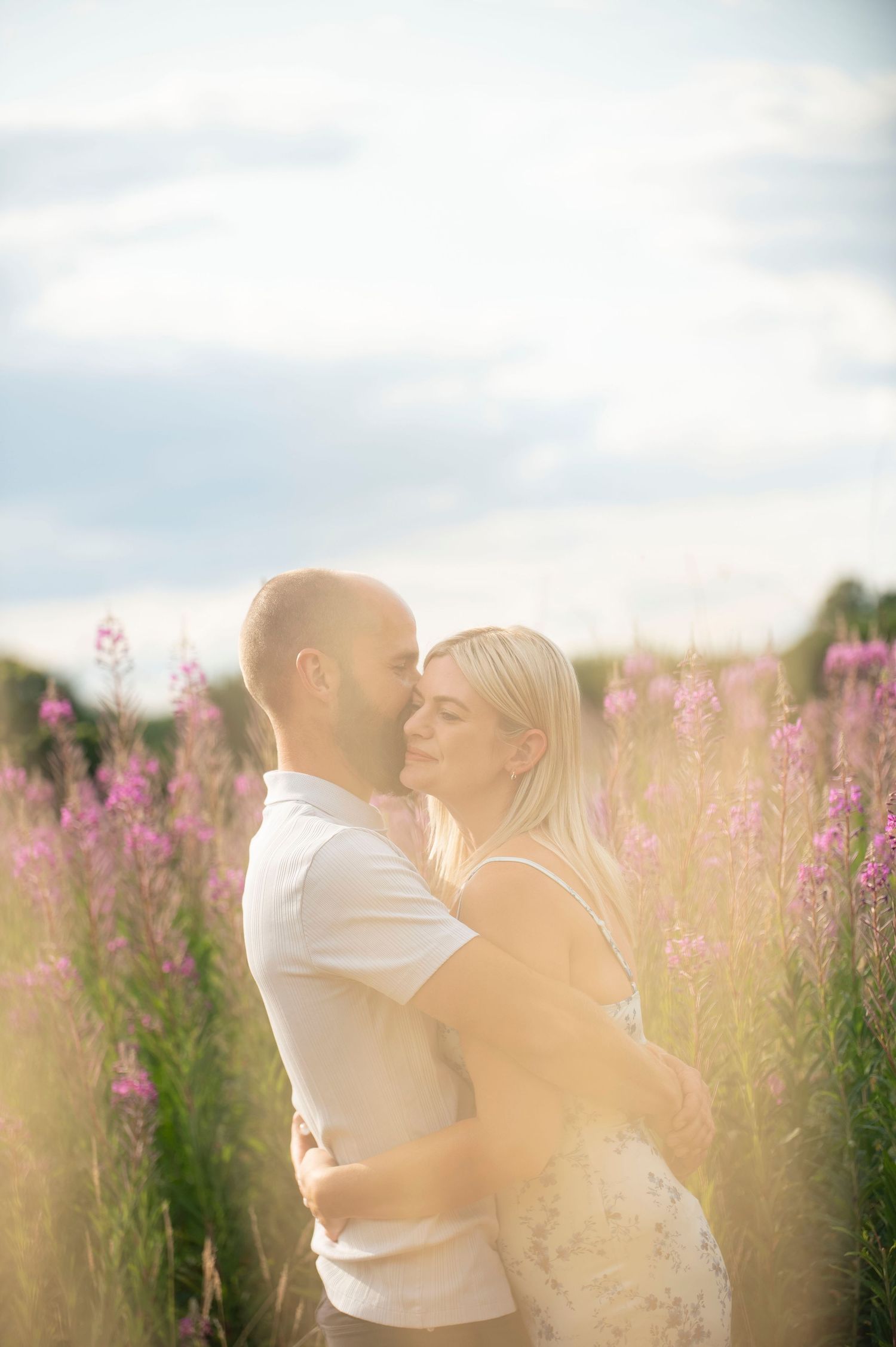 Romantic sunset moment in a field of pink wildflowers.
