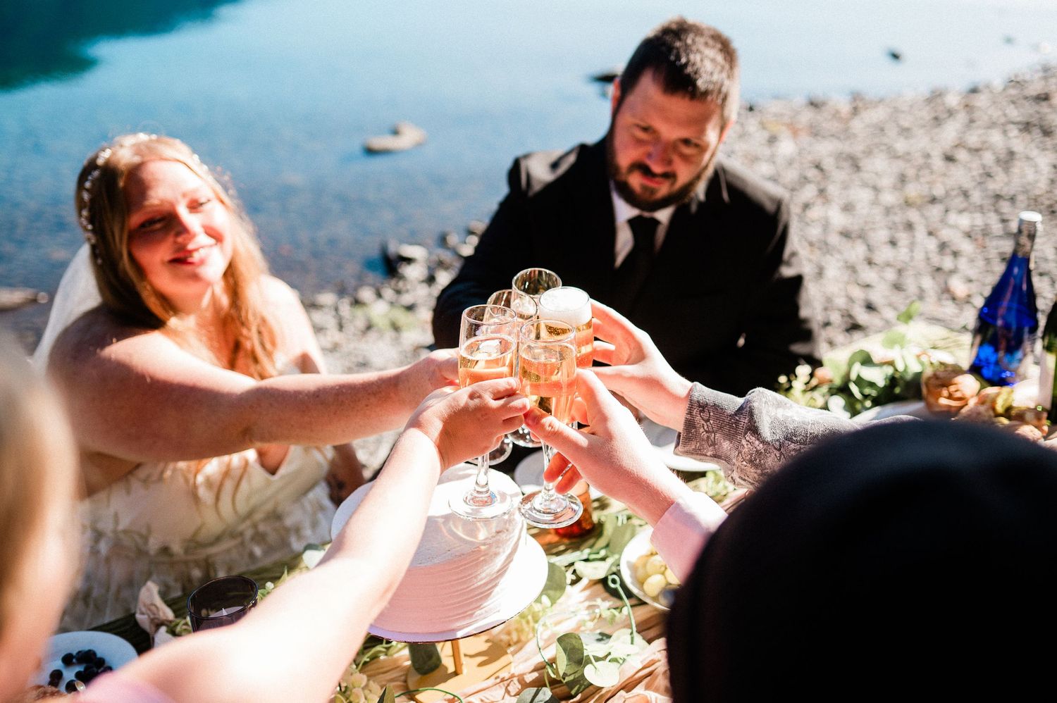 bride and groom toast with champagne with guests