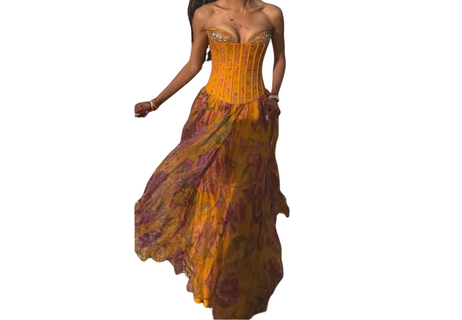 A flowing yellow and purple floral strapless maxi dress with ruffled hem on a white background.