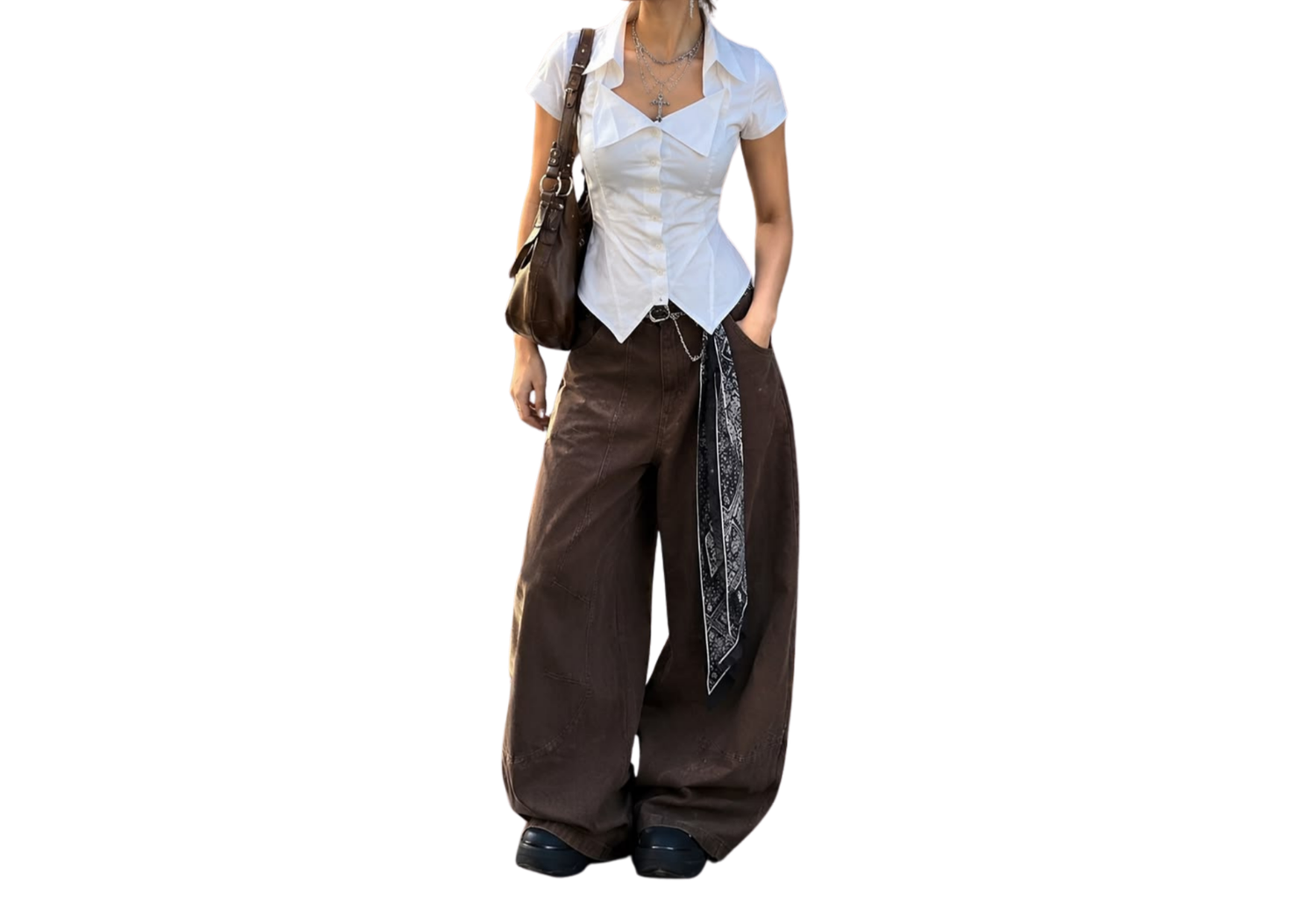 Woman wearing white corset top with brown wide-leg cargo pants and paisley scarf, carrying brown shoulder bag.