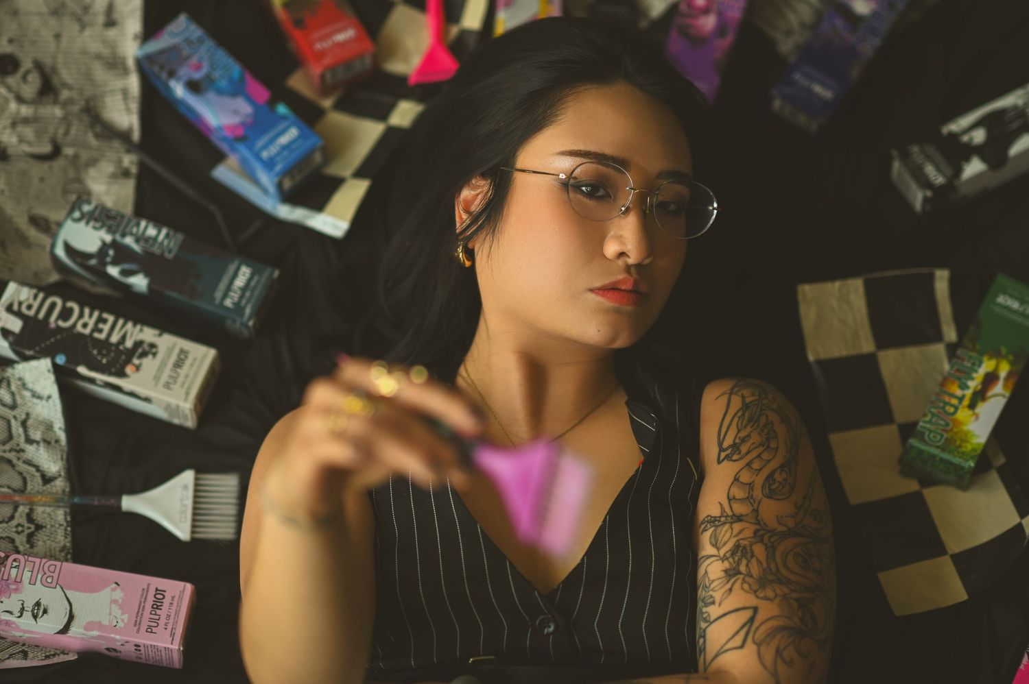 A collage of artistic photos showing dark moody lighting, tattoos, and reflective surfaces in an urban aesthetic.
