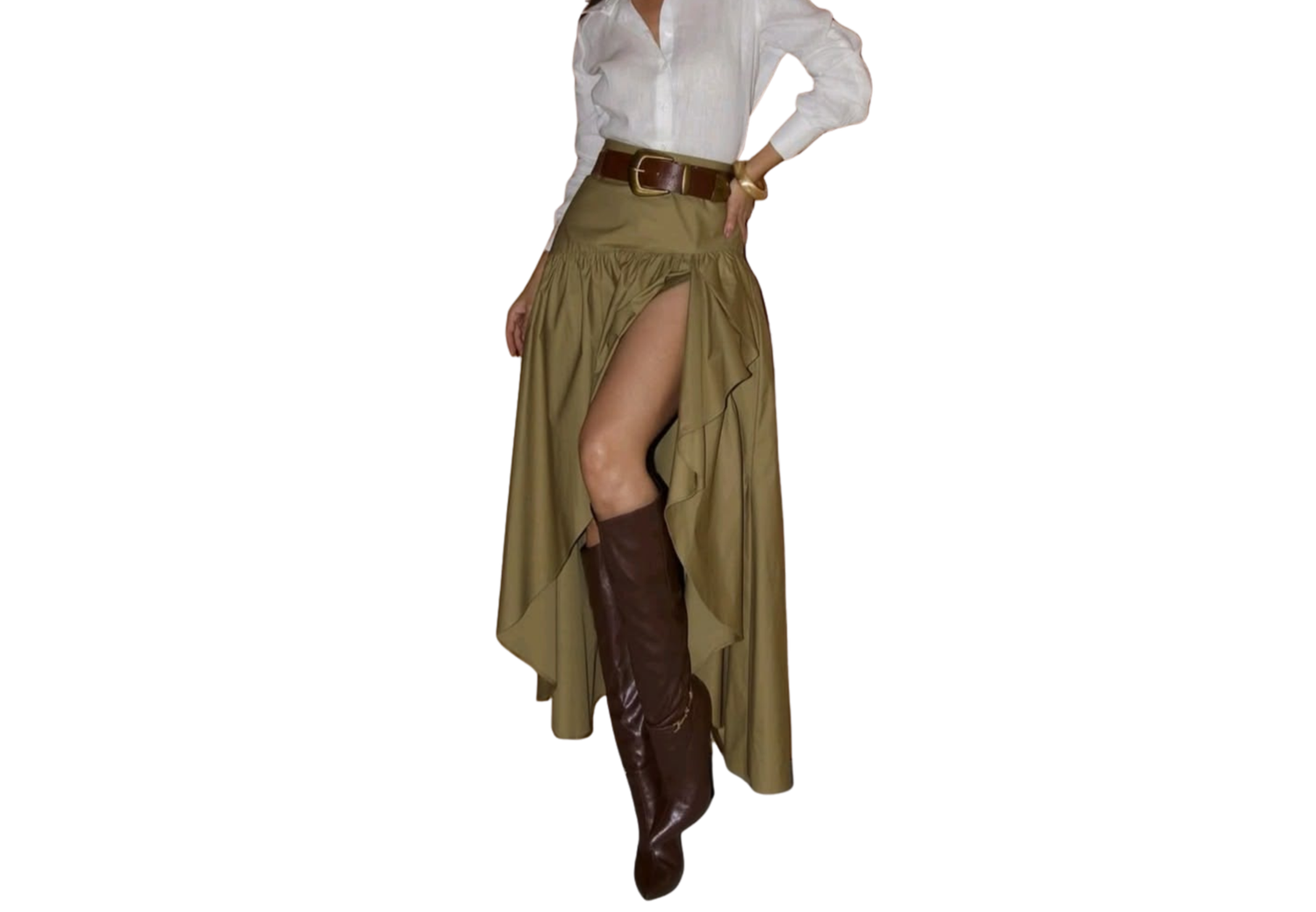 Woman wearing olive green asymmetrical maxi skirt with white blouse, brown leather belt and knee-high boots.