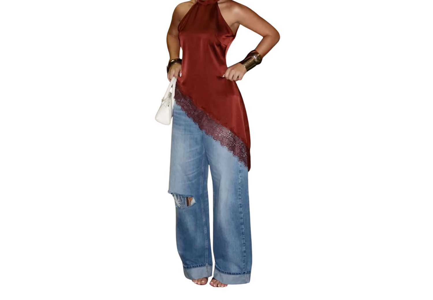 Woman wearing a rust red halter top with lace hem and wide-leg distressed blue jeans holding a white clutch.