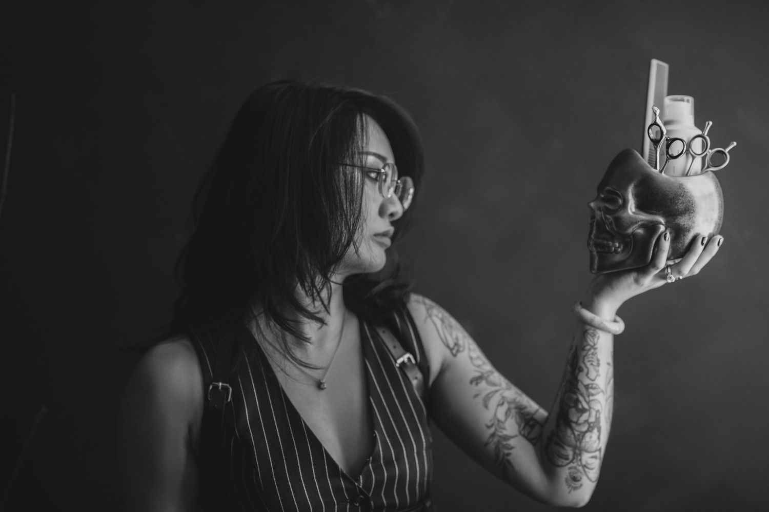 A black and white photo series shows someone smoking a cigarette in dramatic lighting against a dark background.