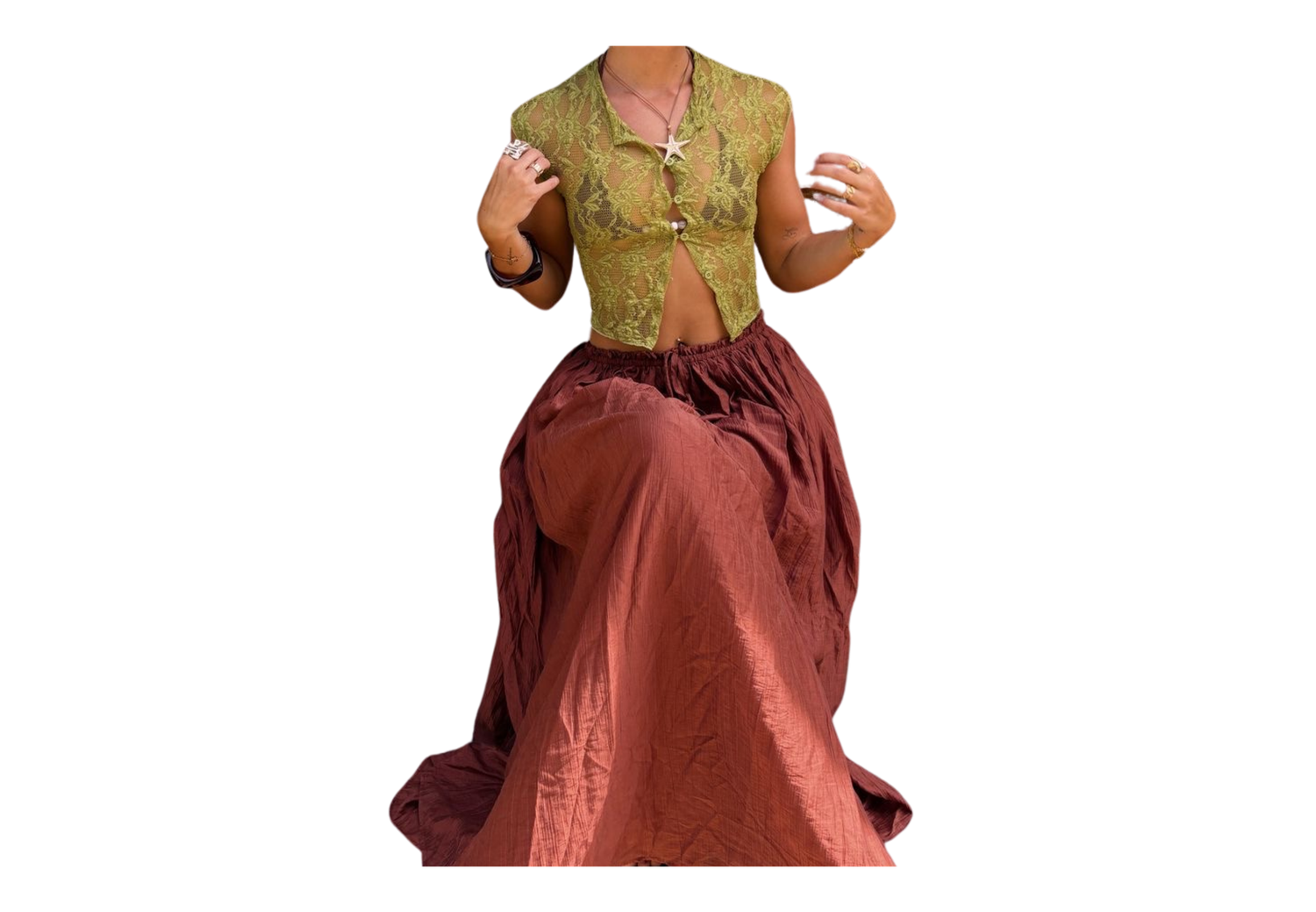 Woman wearing a green embroidered crop top and dusty rose maxi skirt in a traditional Indian fusion outfit.