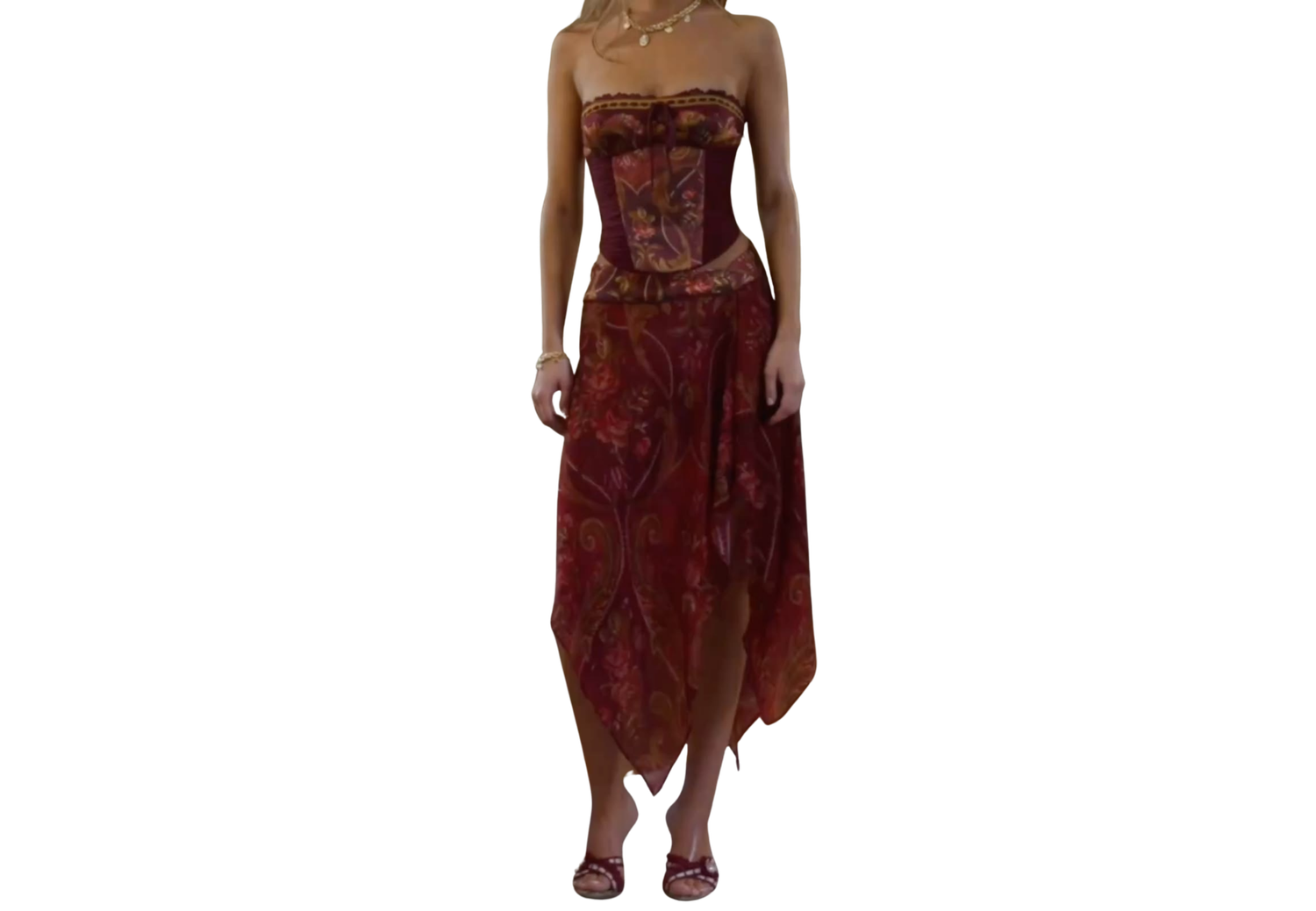 Red paisley strapless corset midi dress with asymmetric handkerchief hem and strappy heels.
