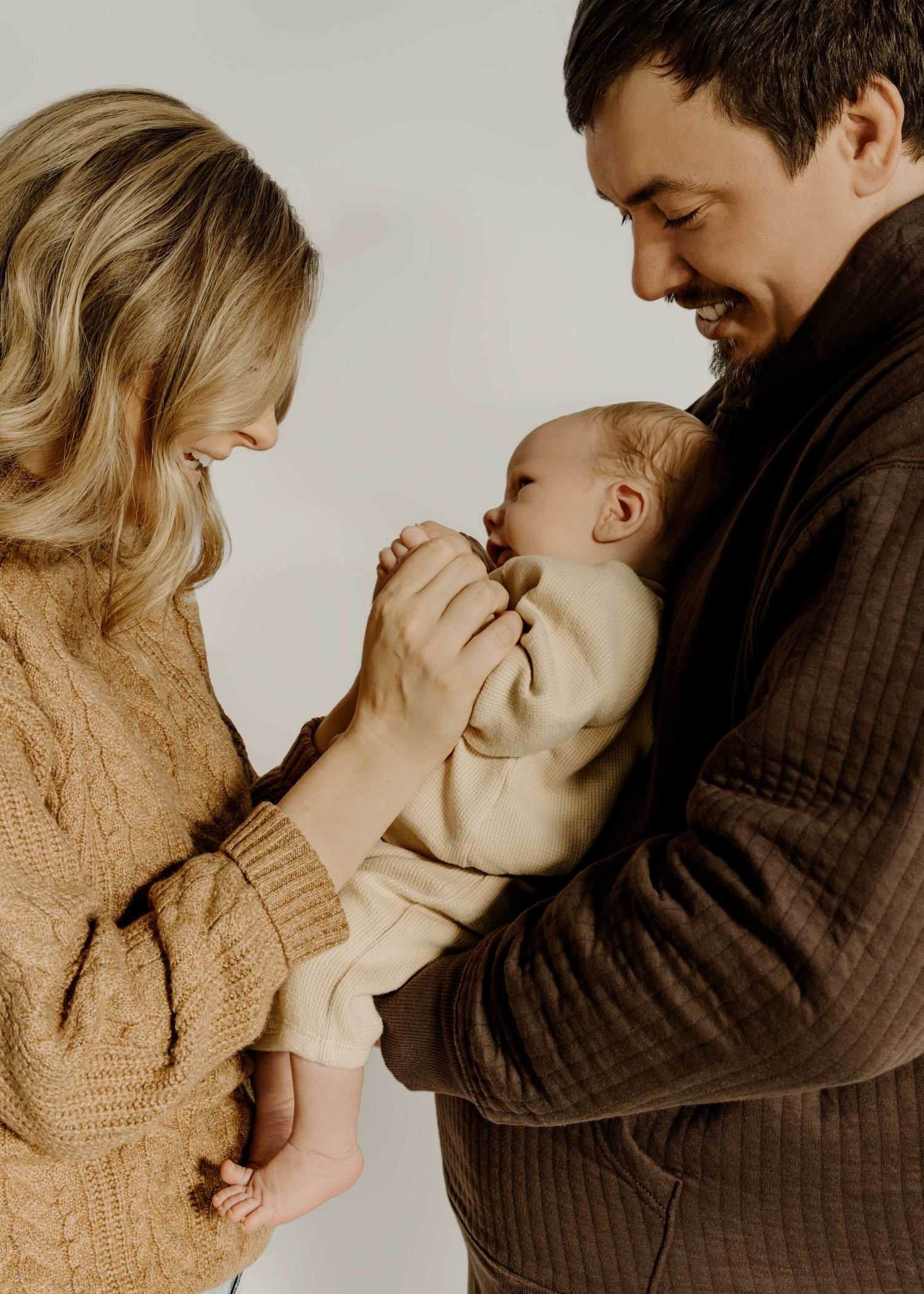 Romantic indoor photoshoot featuring gentle embraces and intimate moments.
