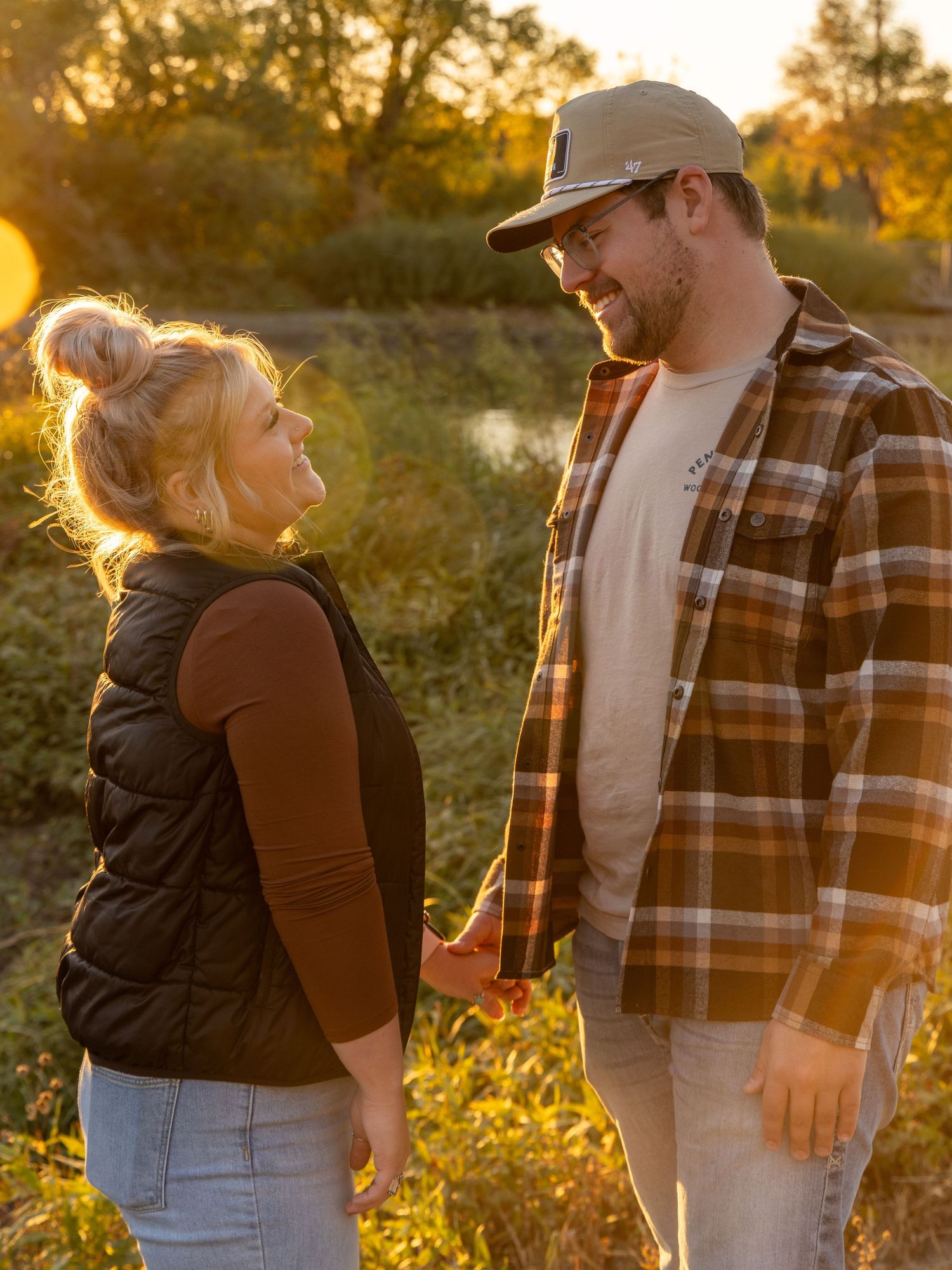 Casual outdoor portraits with golden sunlight and natural autumn backdrop.