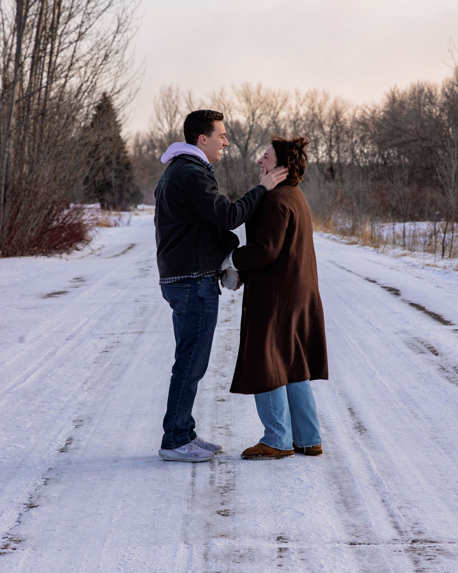Series of silhouettes showing a couple's romantic interaction on a snow-covered path.