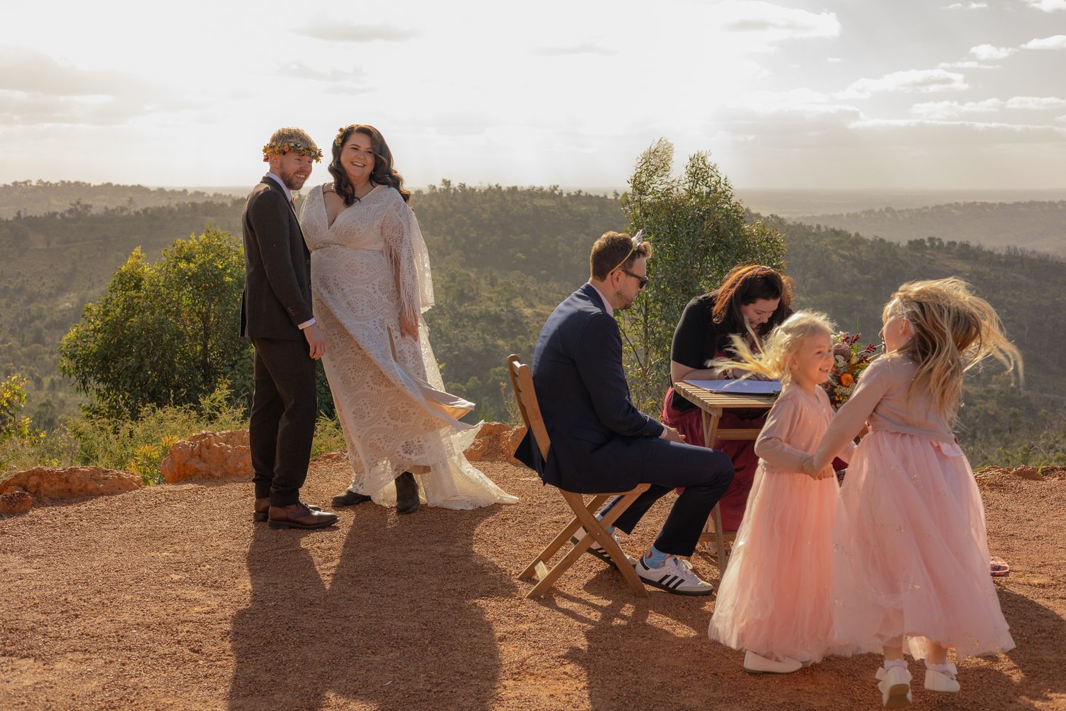 A series of outdoor wedding photos showing couples and guests enjoying scenic mountain views at sunset.