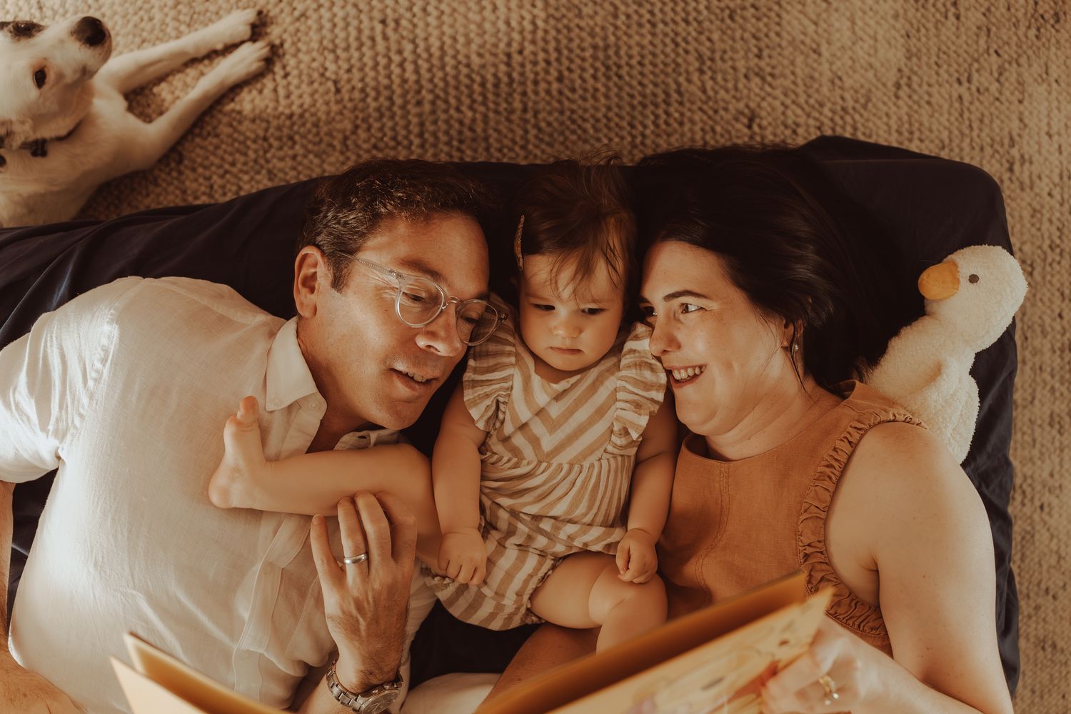 A tender family moment captured in a collage of intimate black and white photographs showing rest and connection.