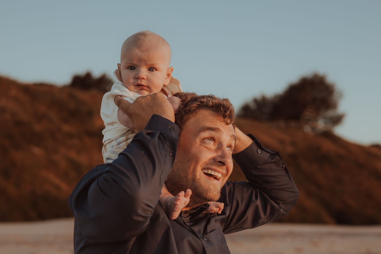 A series of candid outdoor photos showing tender moments between a parent and young child at sunset.