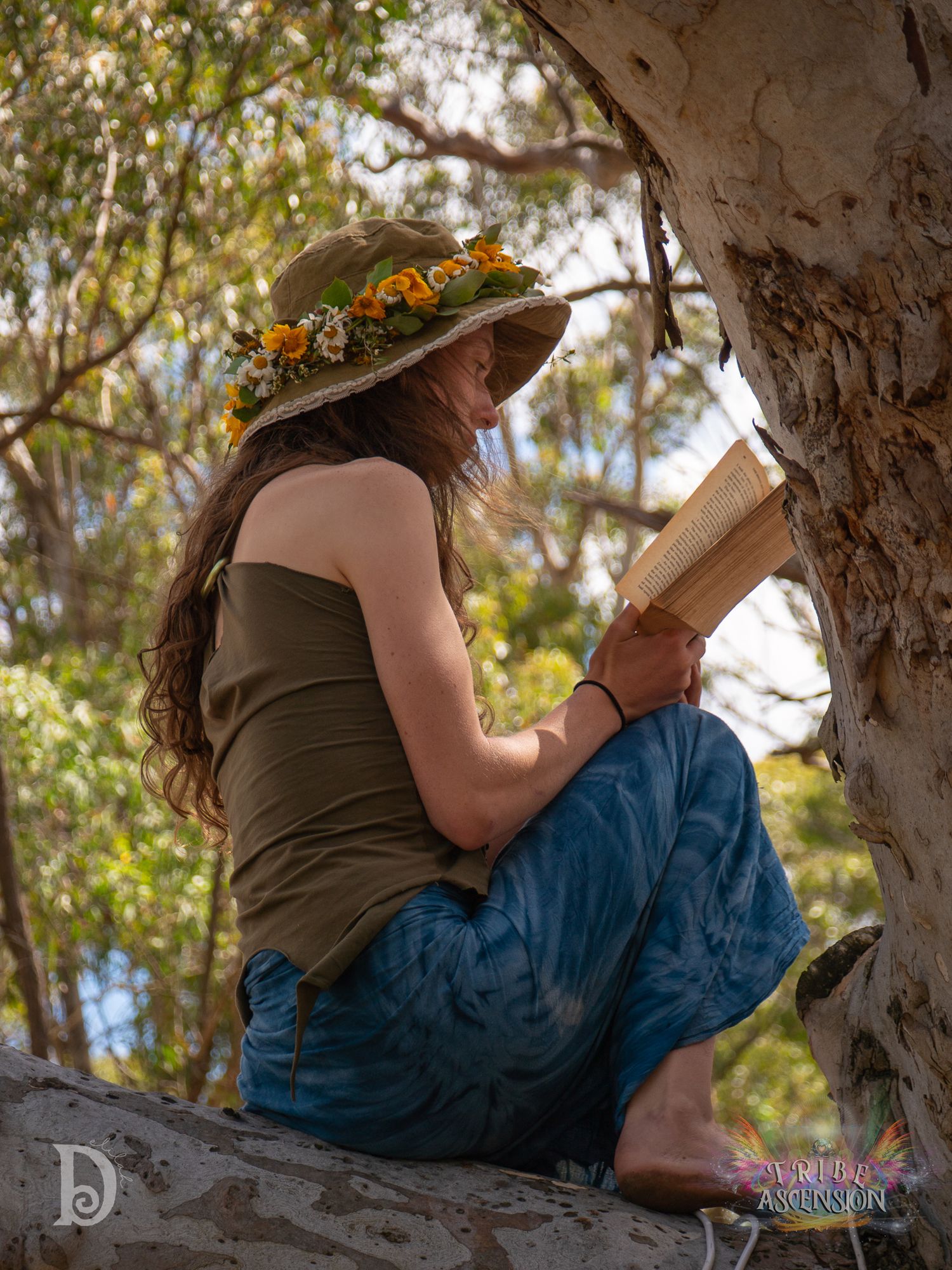 Woman reading book in tree