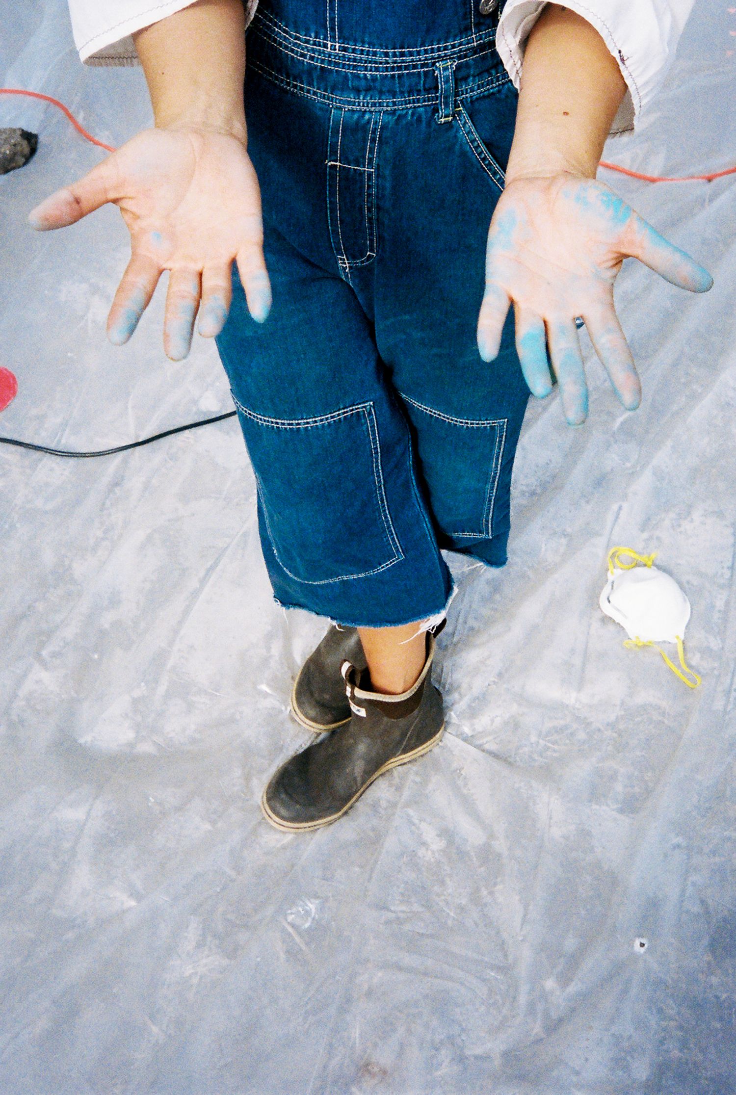 Paint covered hands after a hard day's work