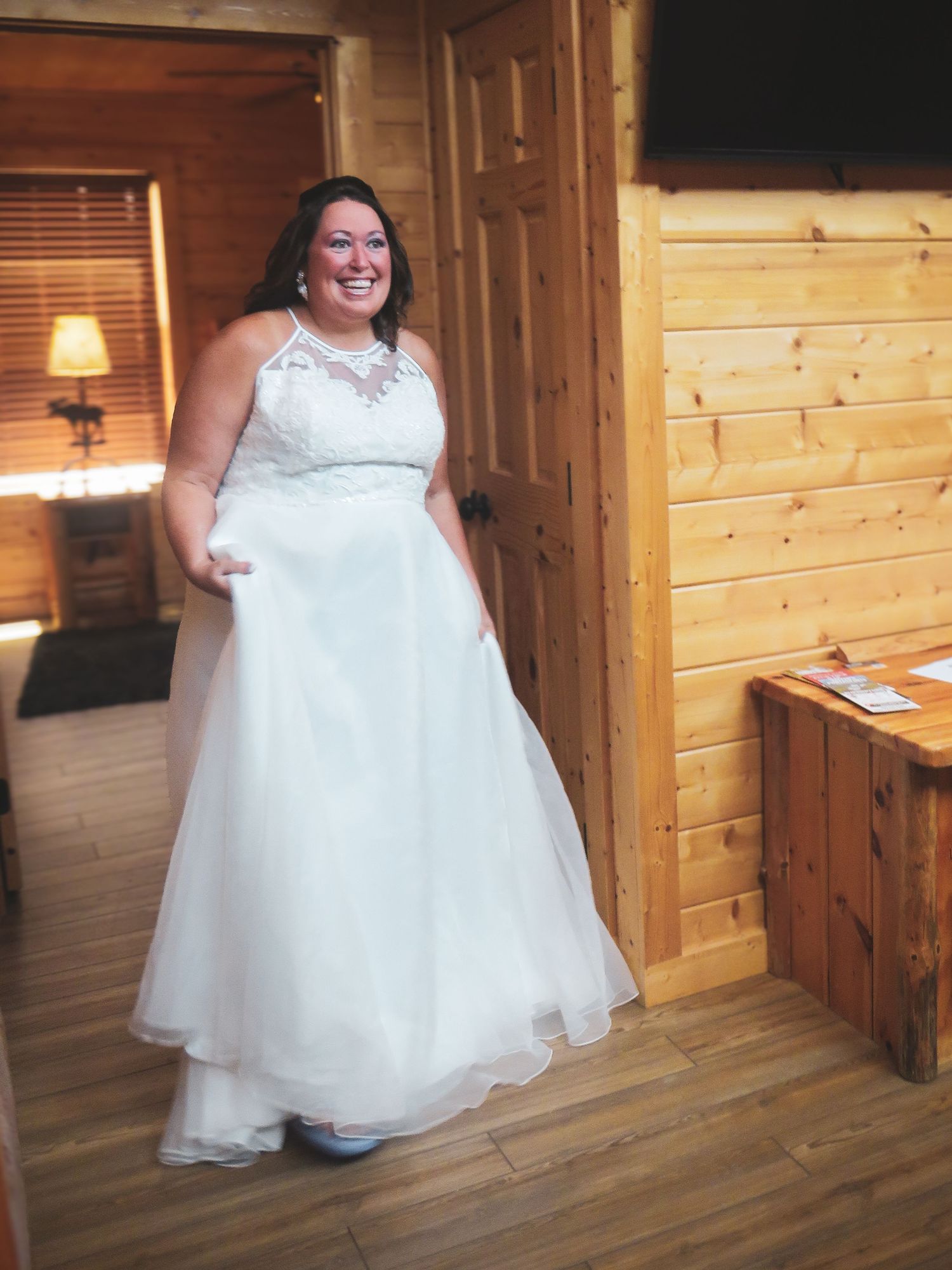 A white wedding dress is displayed in different angles on a wooden porch with natural lighting.