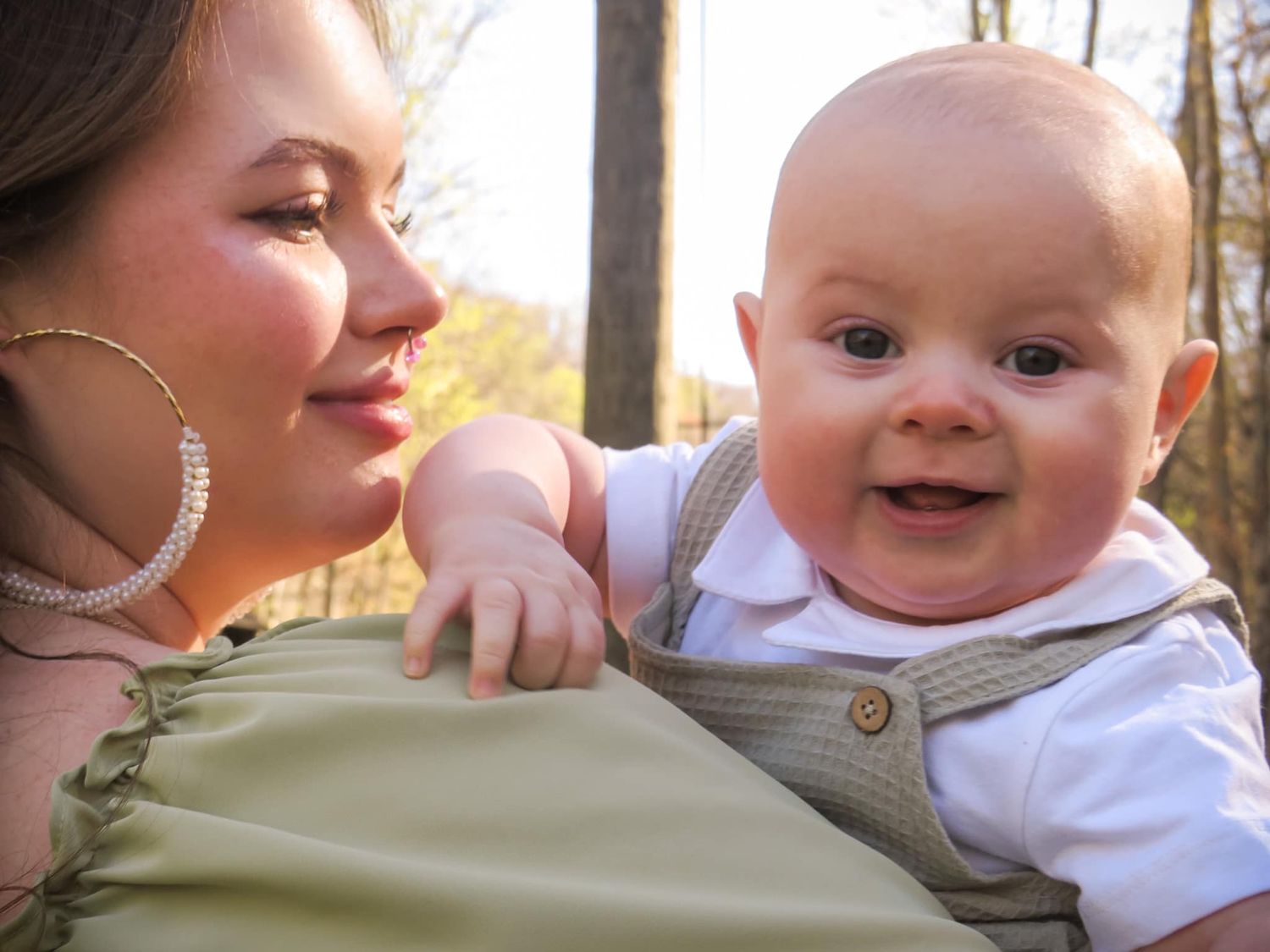 Sweet candid moments of a baby and caregiver sharing joyful interactions.