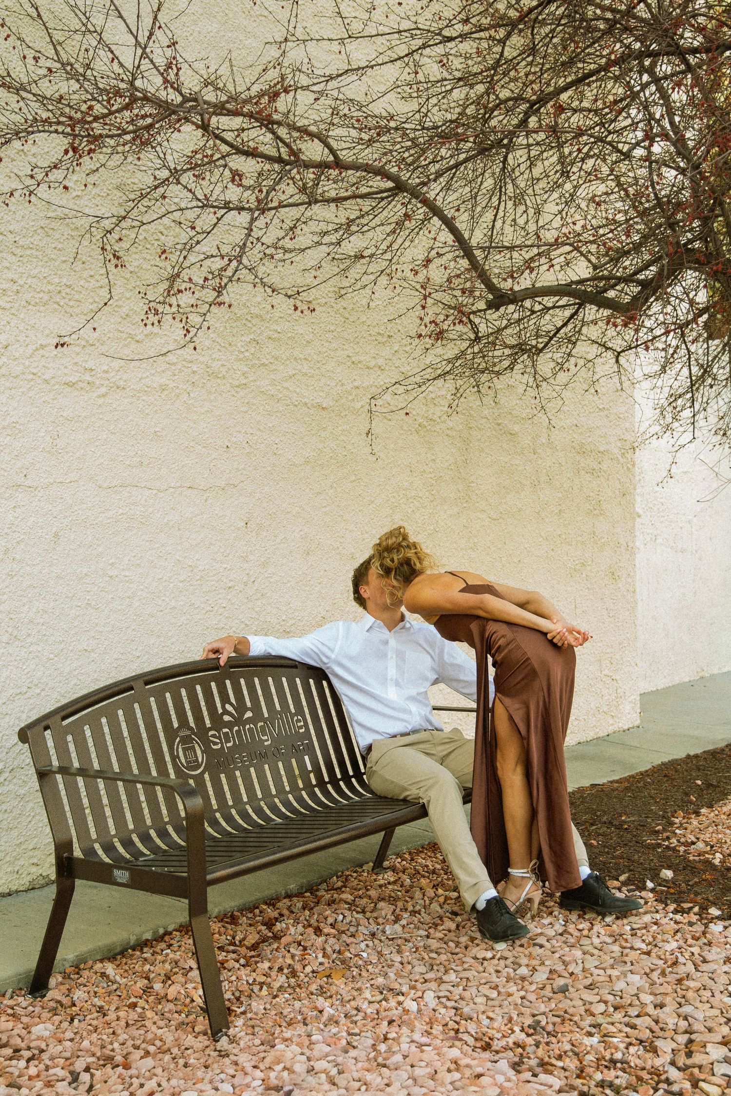 A sequence of photos showing a park bench against a white wall with autumn leaves on the ground.