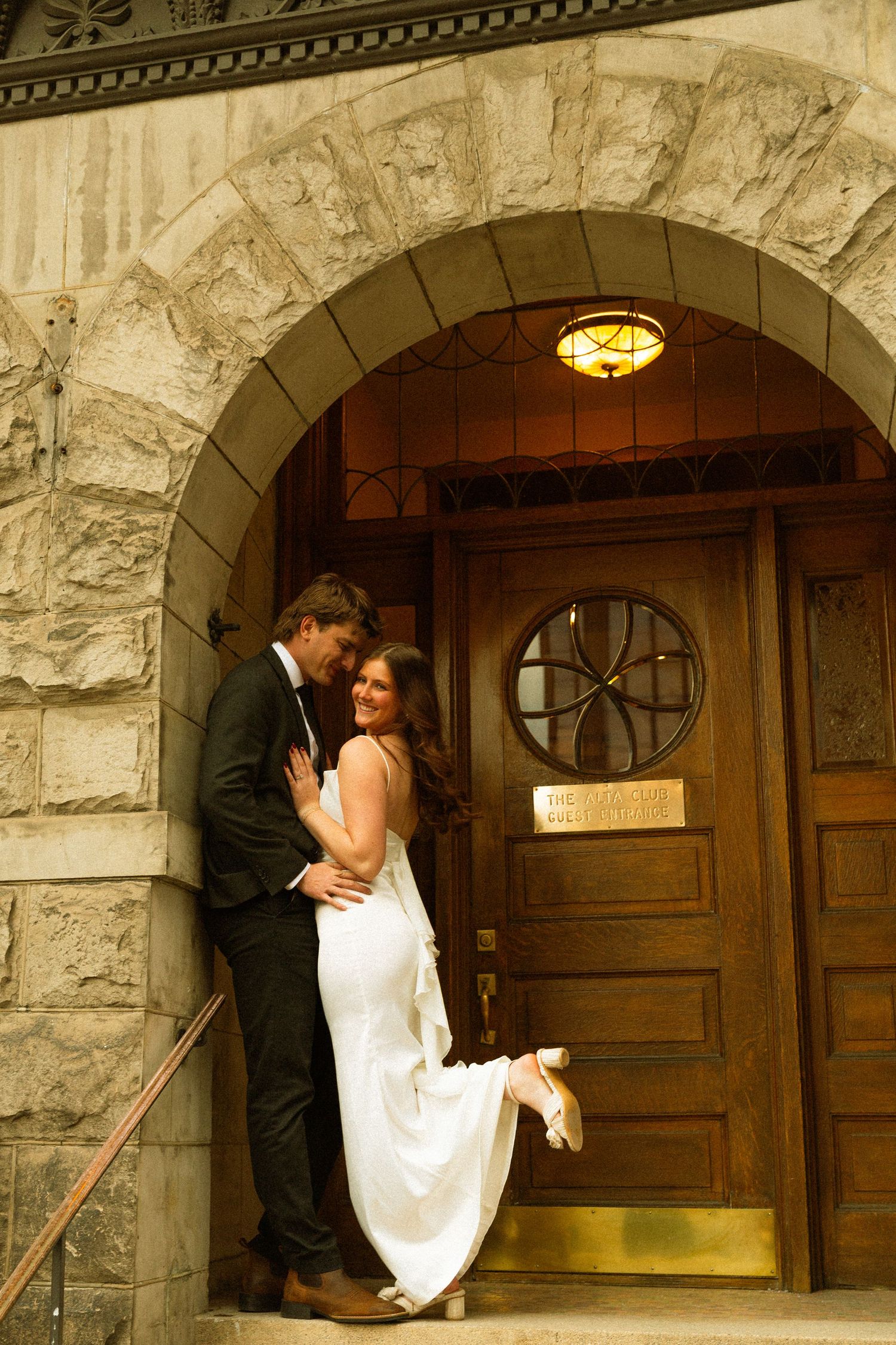 A romantic wedding photo sequence showing a couple embracing in front of an elegant stone church entrance.