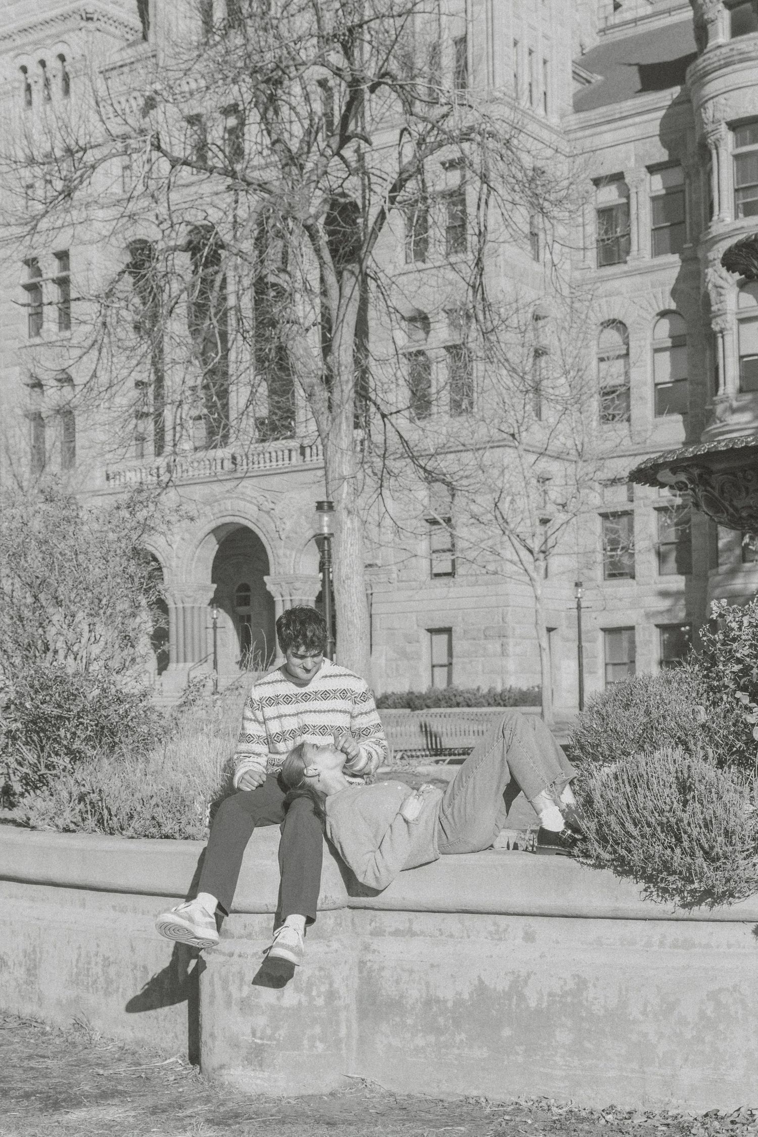 Five vintage black and white photographs showing people playing and posing in front of a historic stone building.