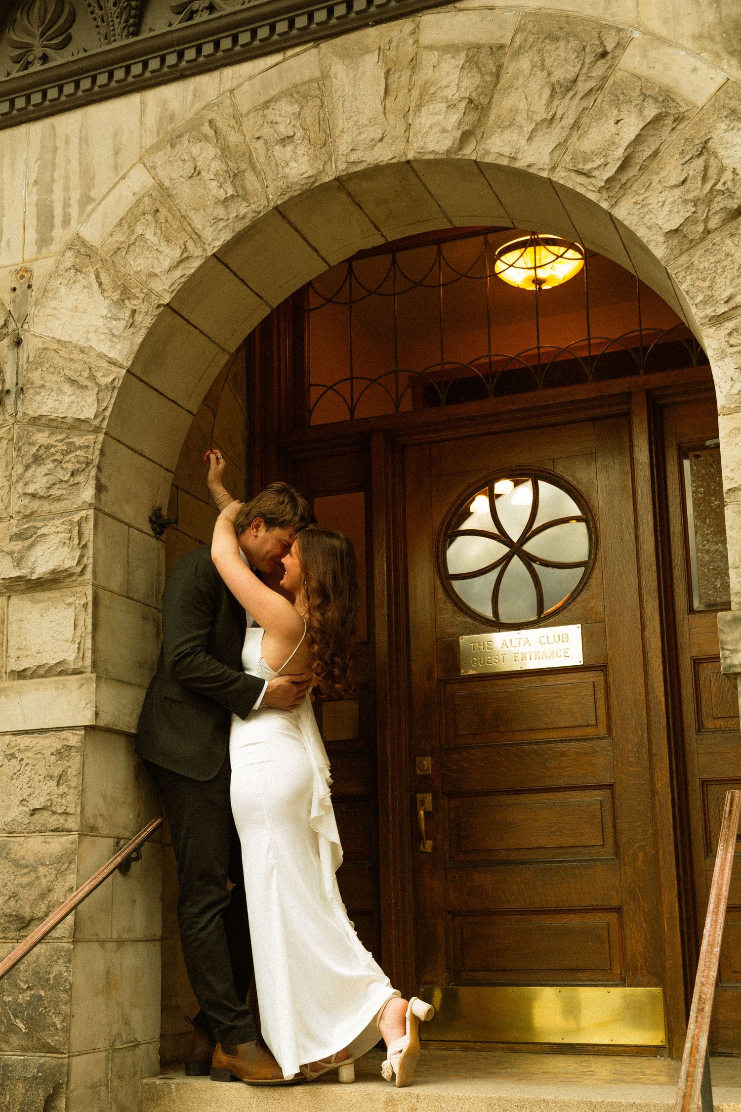 A sequence of photos shows someone opening a large wooden door with an arched stone entrance.