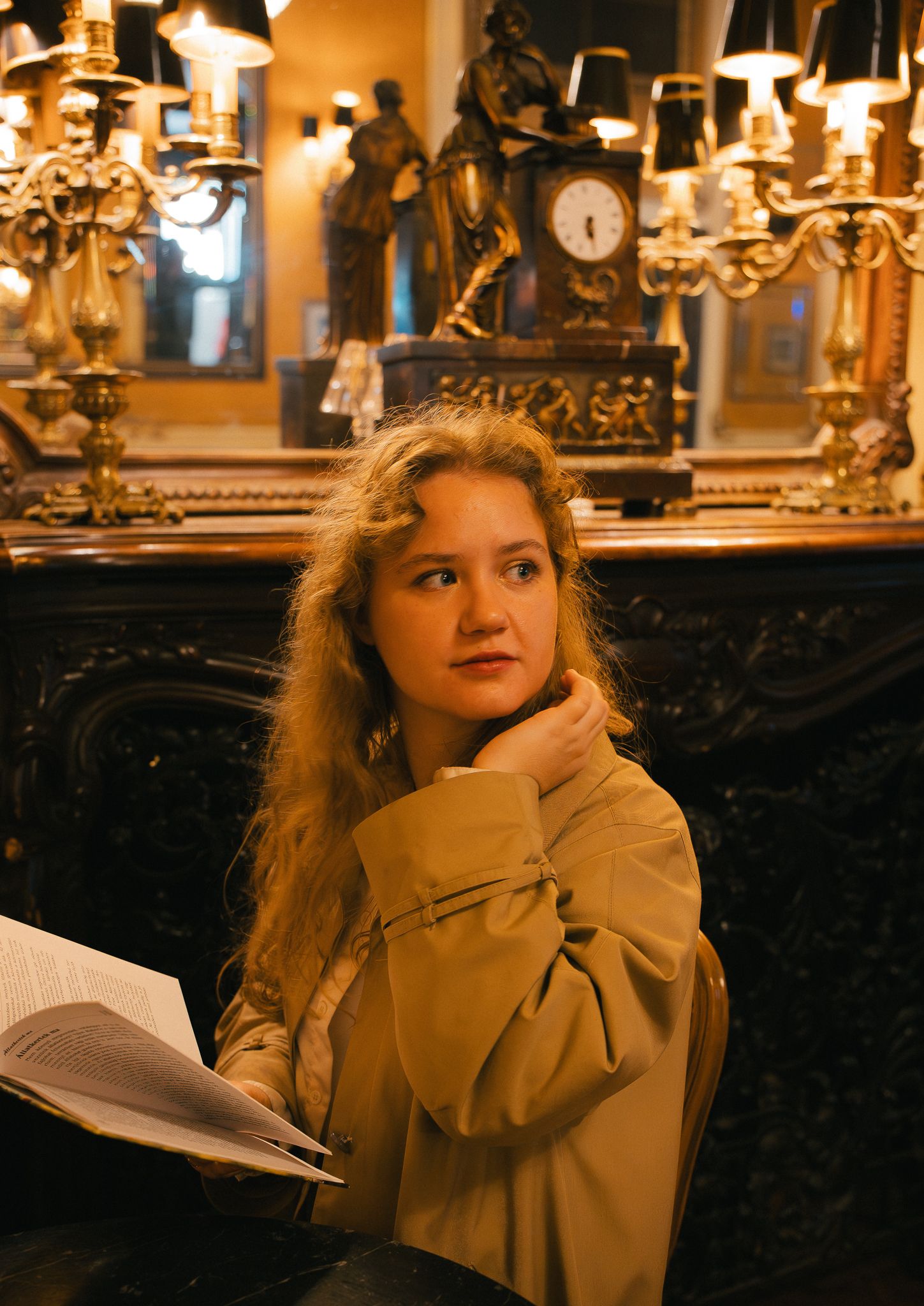 A woman is looking dreamy at a library in Budapest.