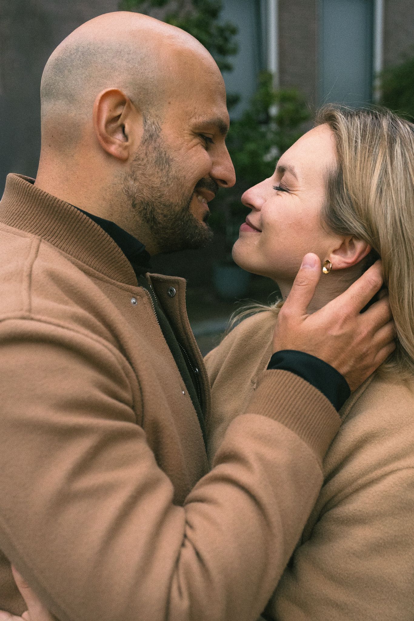 Close-up portrait of a couple with relaxed posture and loving looks.