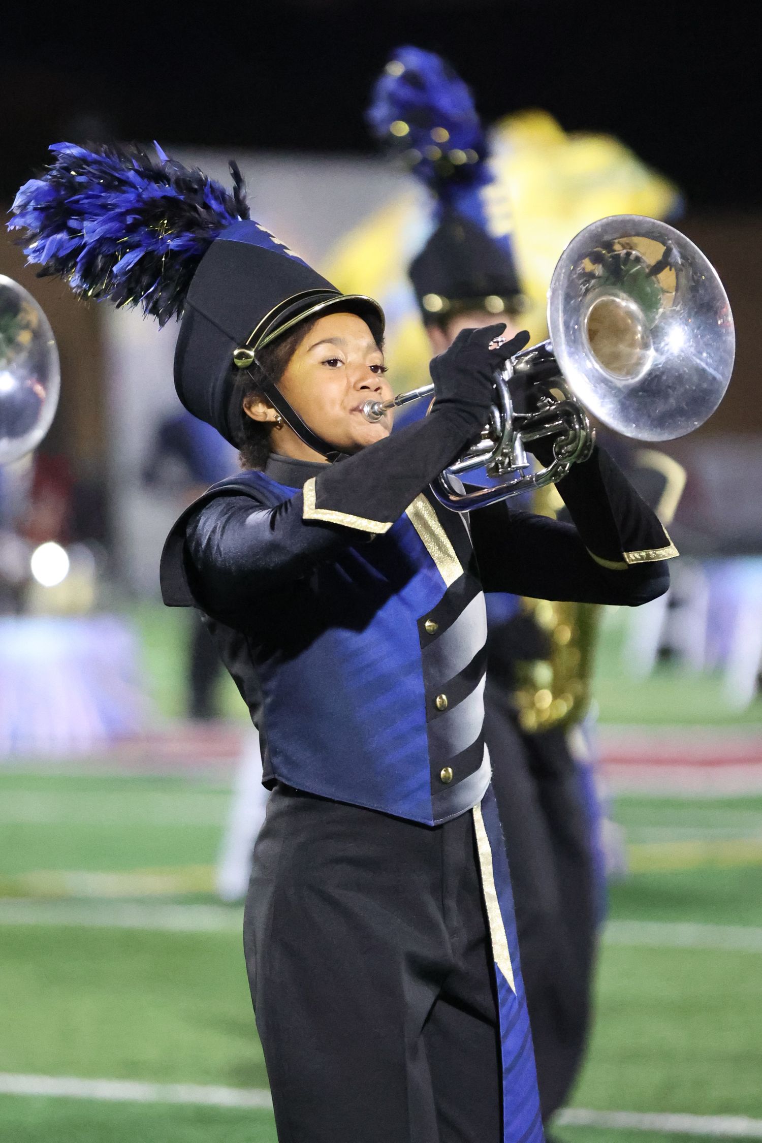 Marching band melo player performing during a halftime show