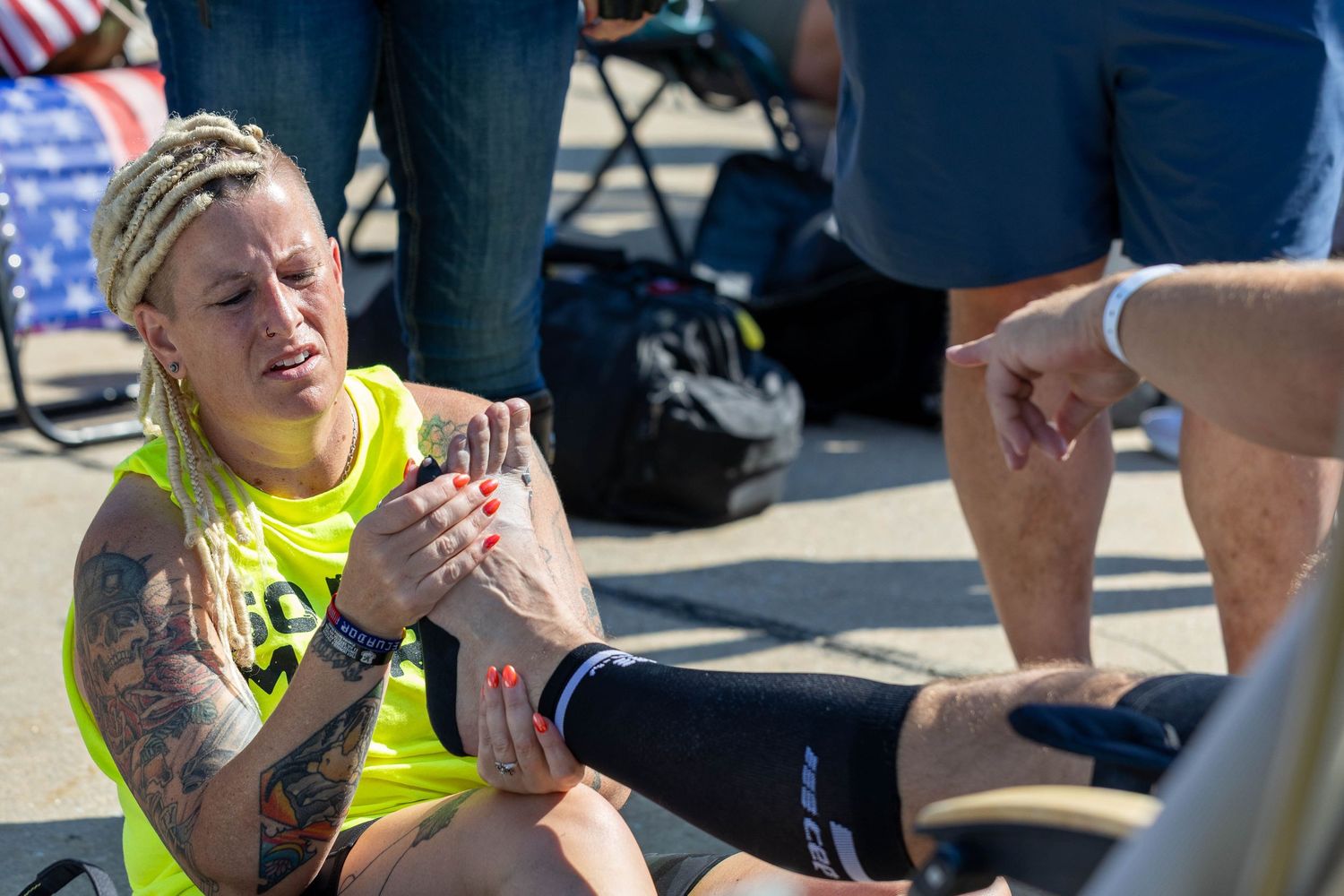 volunteer taking care of sore feet during 50 mile march break