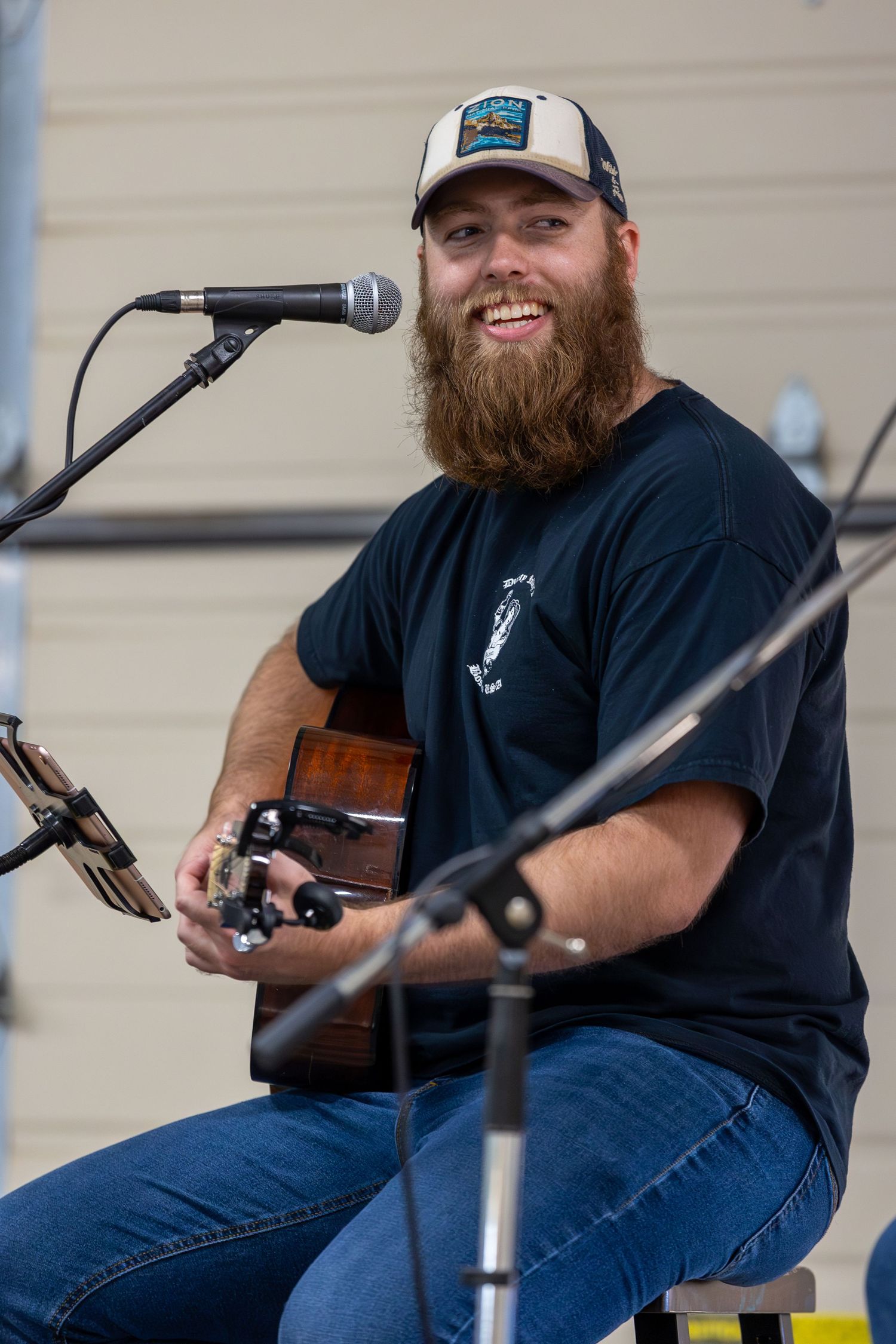 josh cole performing during smoke your butt off bbq event