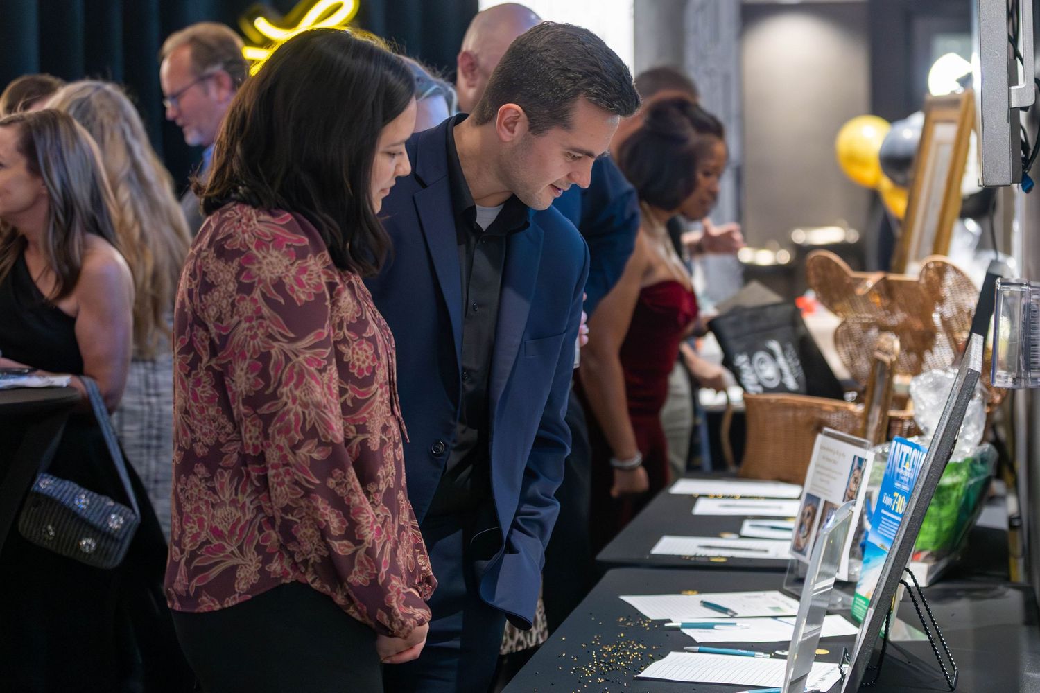 Donors looking at raffle items during 1st annual Town and Country Gala