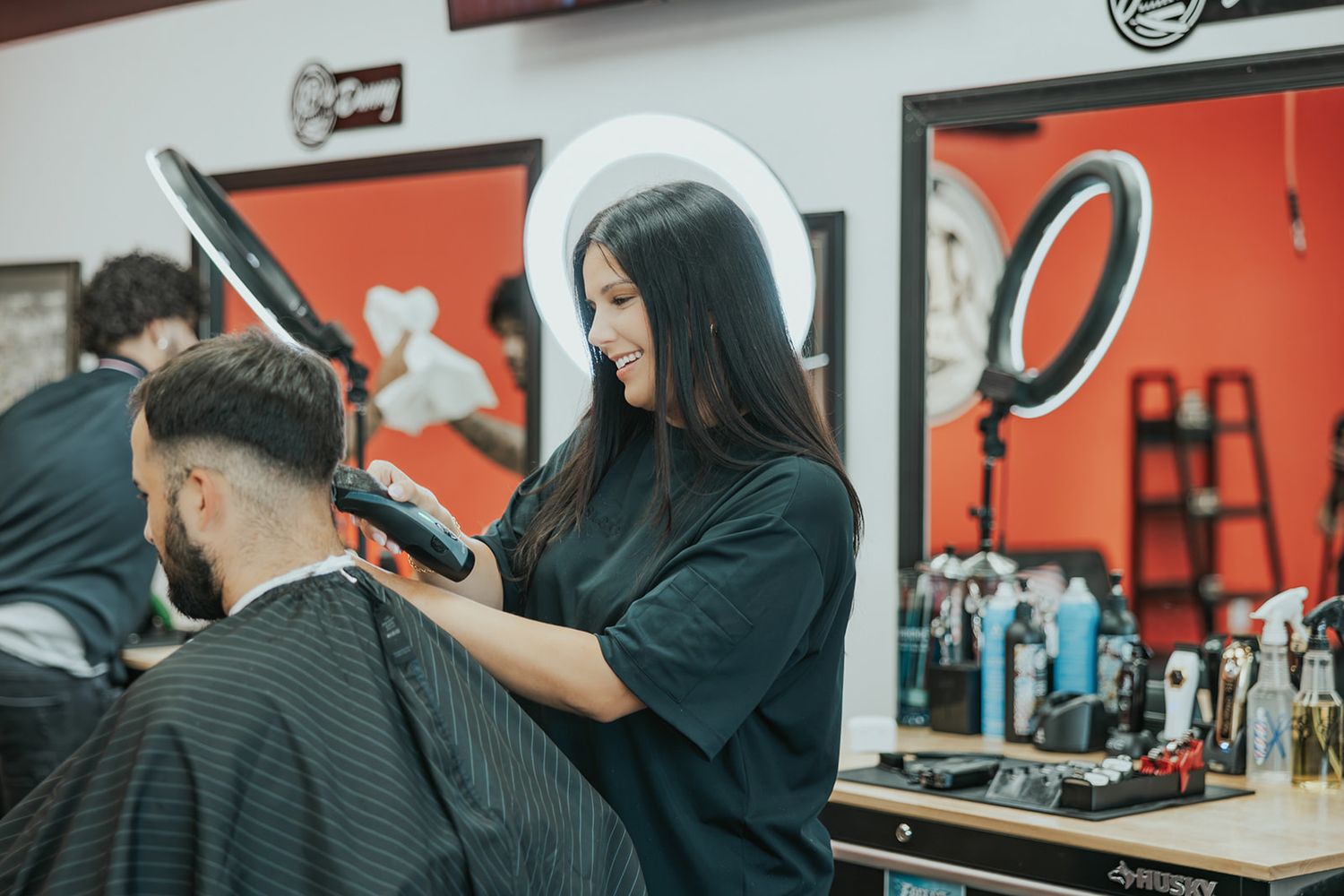 Barber shop interior scenes with red walls and styling stations.