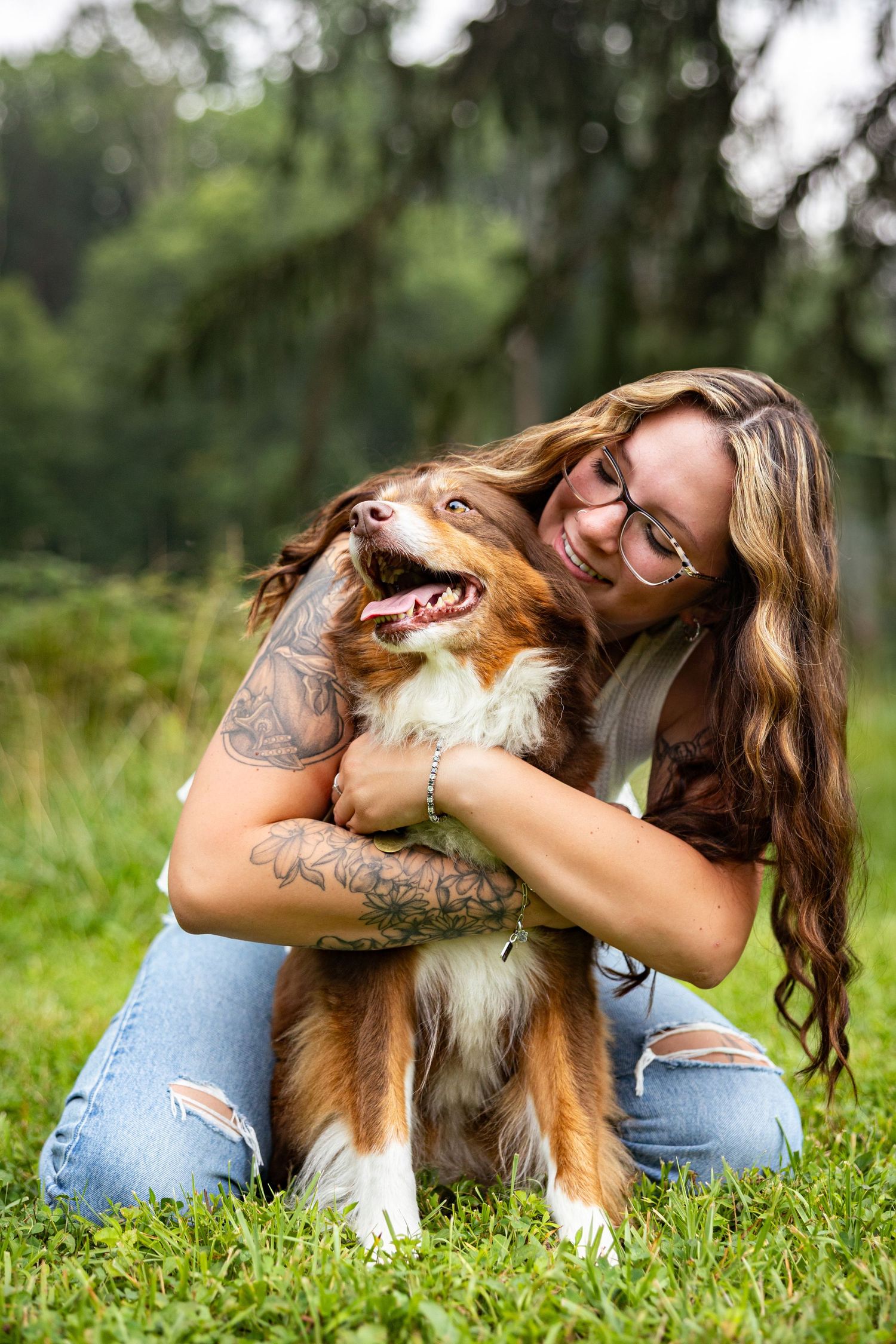 Heartwarming moments between a Shetland Sheepdog and its owner playing together in a grassy field.