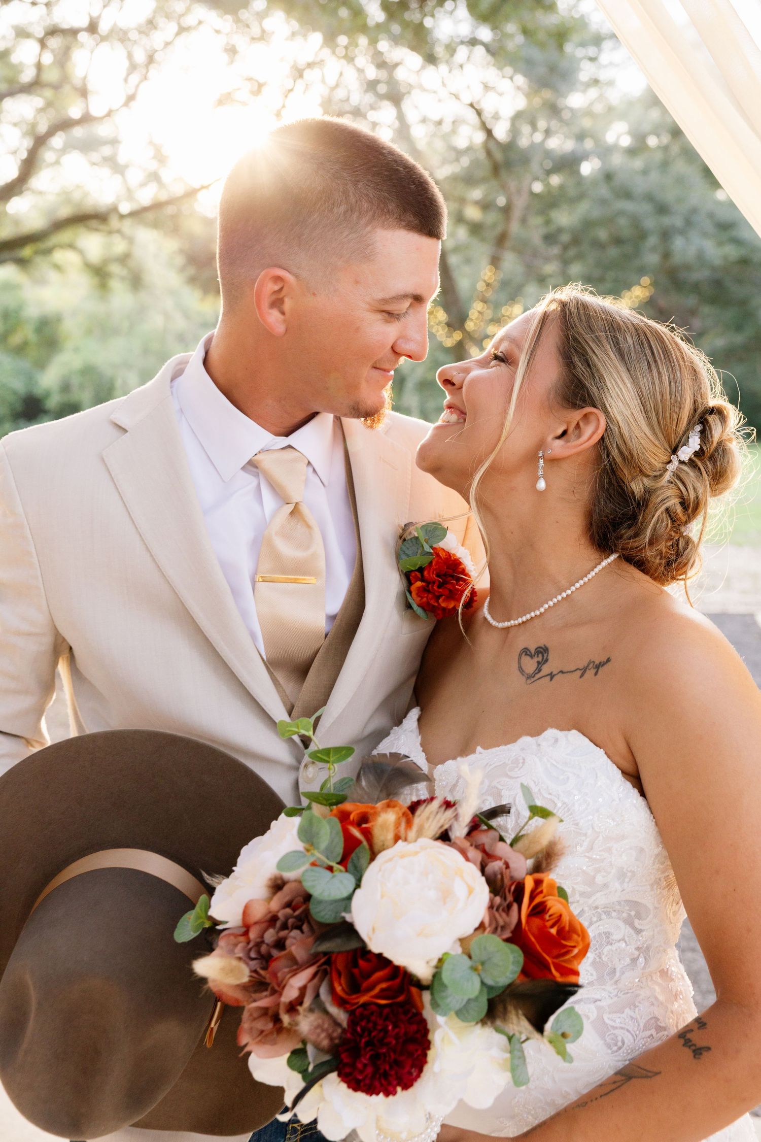 Bride and groom share a romantic moment, captured by wedding photographer at Chandelier Oaks Wedding Venue, Alyson Williams Photography