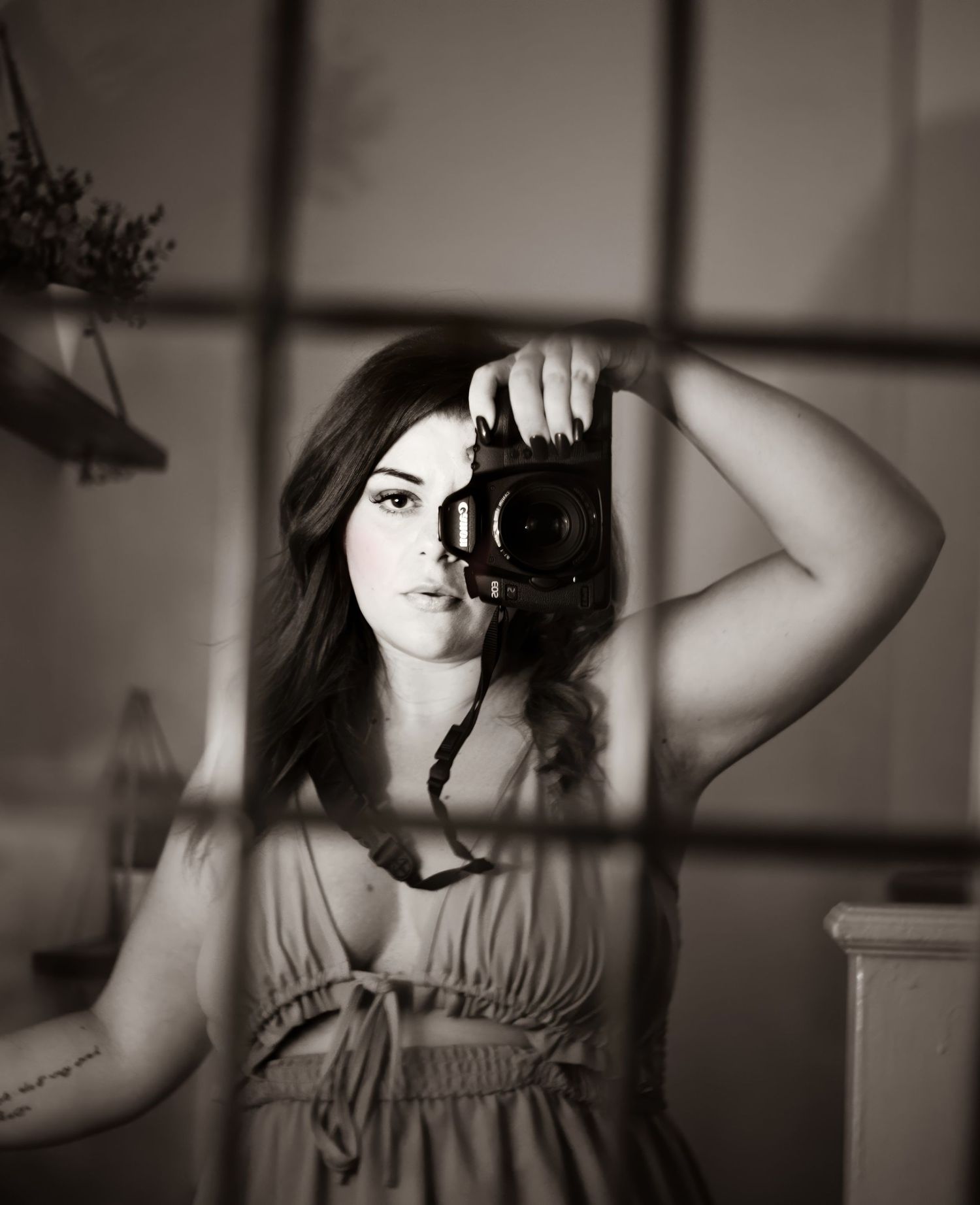 Black and white self portrait series of photographer with camera.