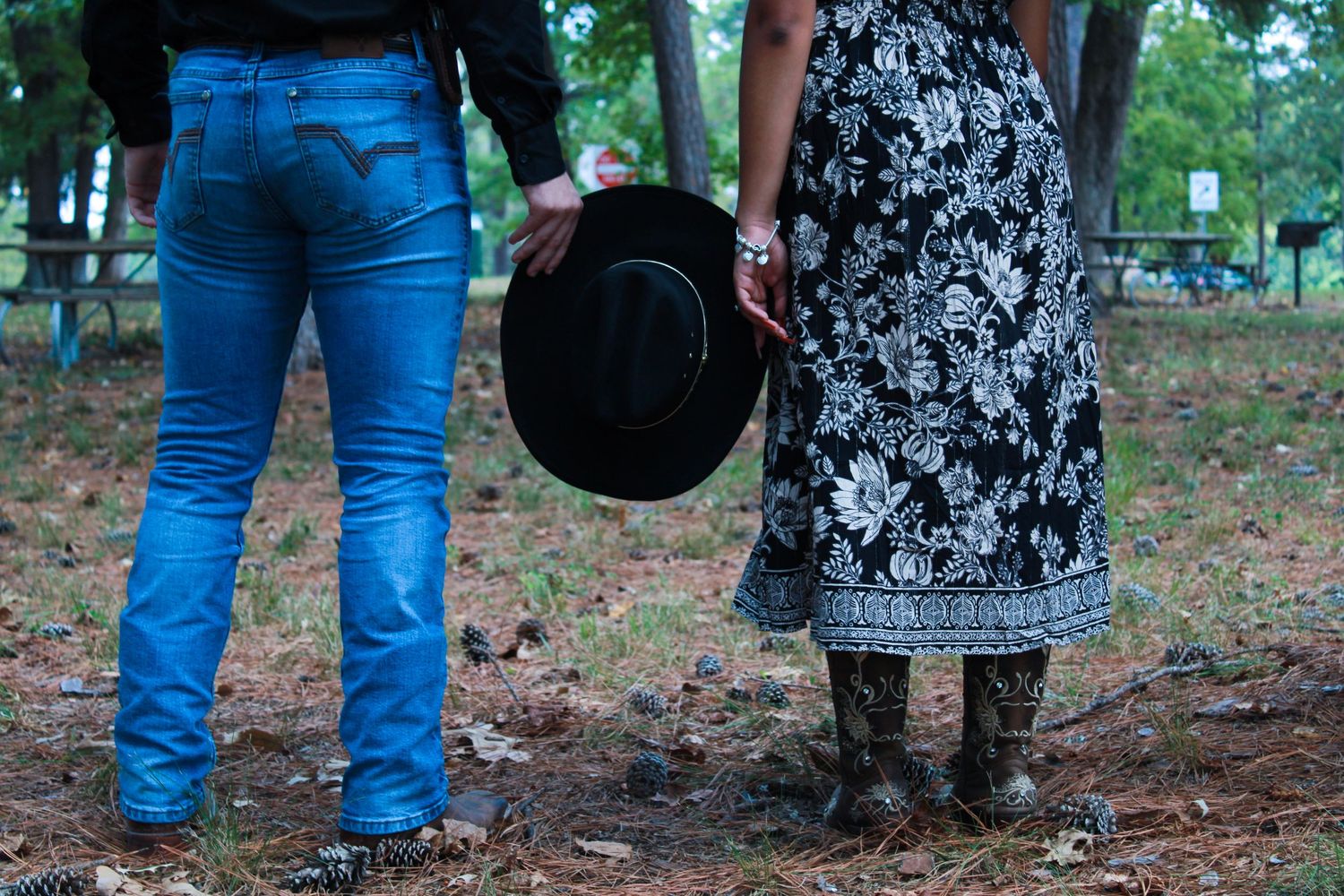 Casual outfits shown from waist down with floral dress and blue jeans.
