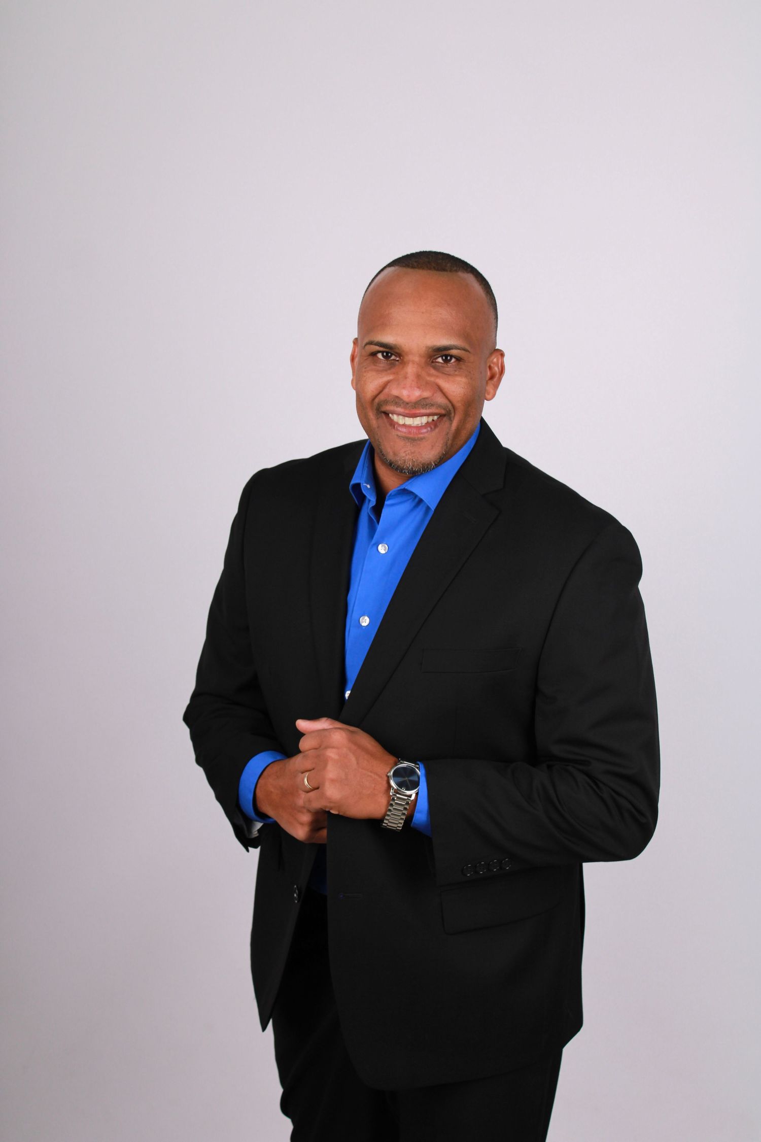 Studio portraits showing dynamic poses in professional business attire.