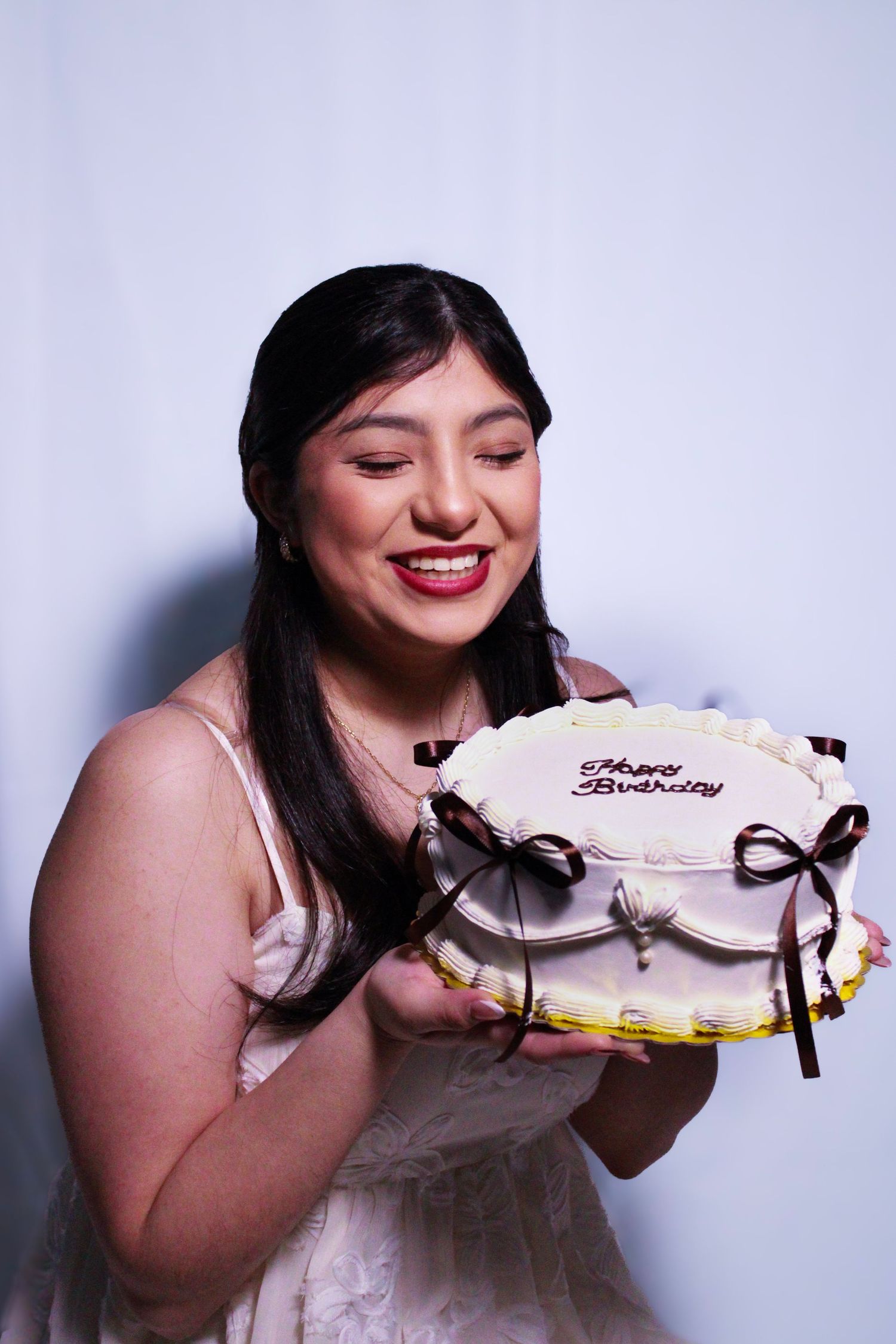 A playful cake-eating photo sequence with white and brown decorative elements.