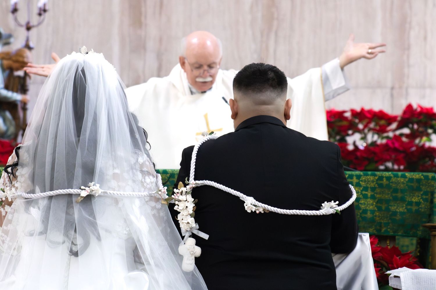 Wedding ceremony proceedings in a church adorned with seasonal red poinsettias.