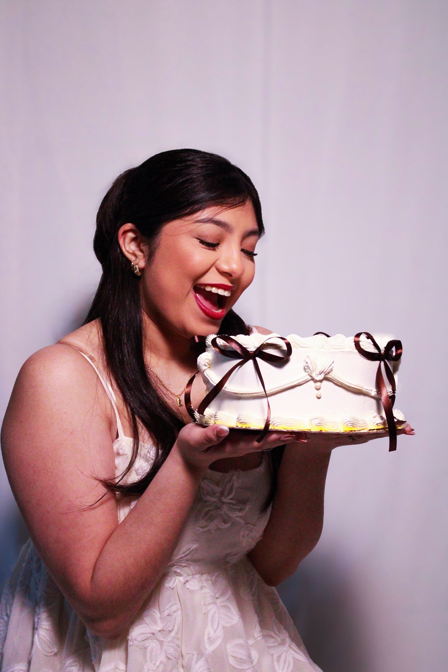 A celebratory photo series showing someone enjoying cake against a pink background.