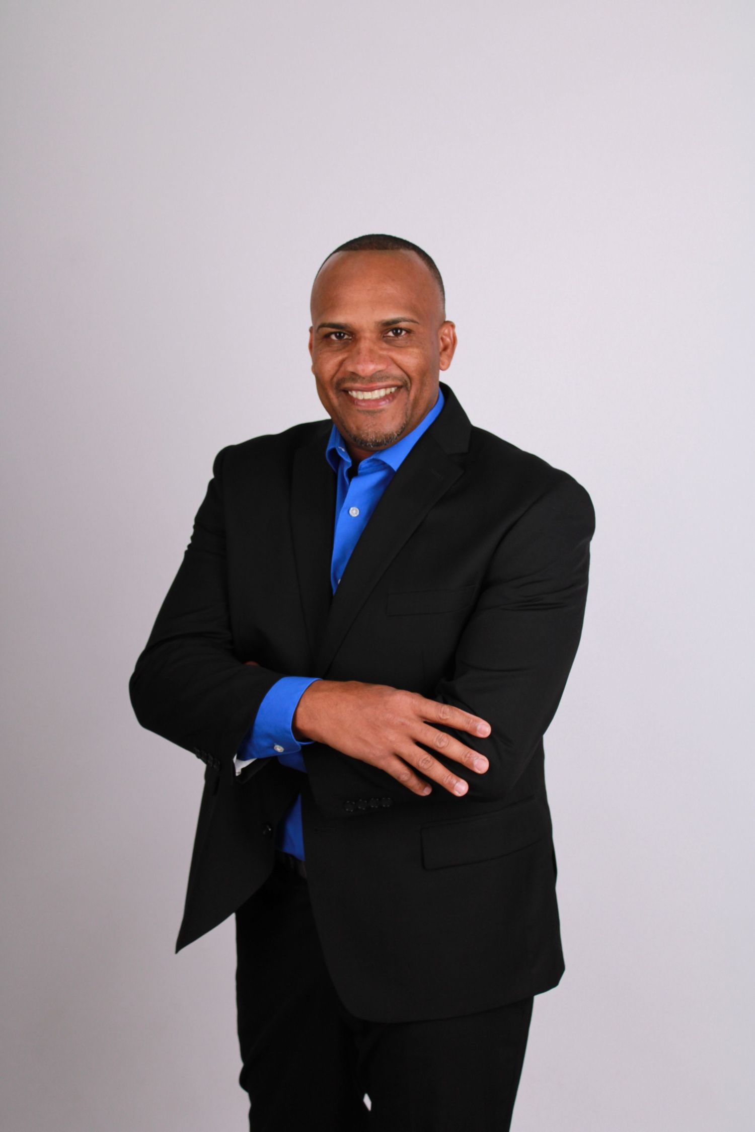 Professional headshots featuring warm expressions and business formal wear.