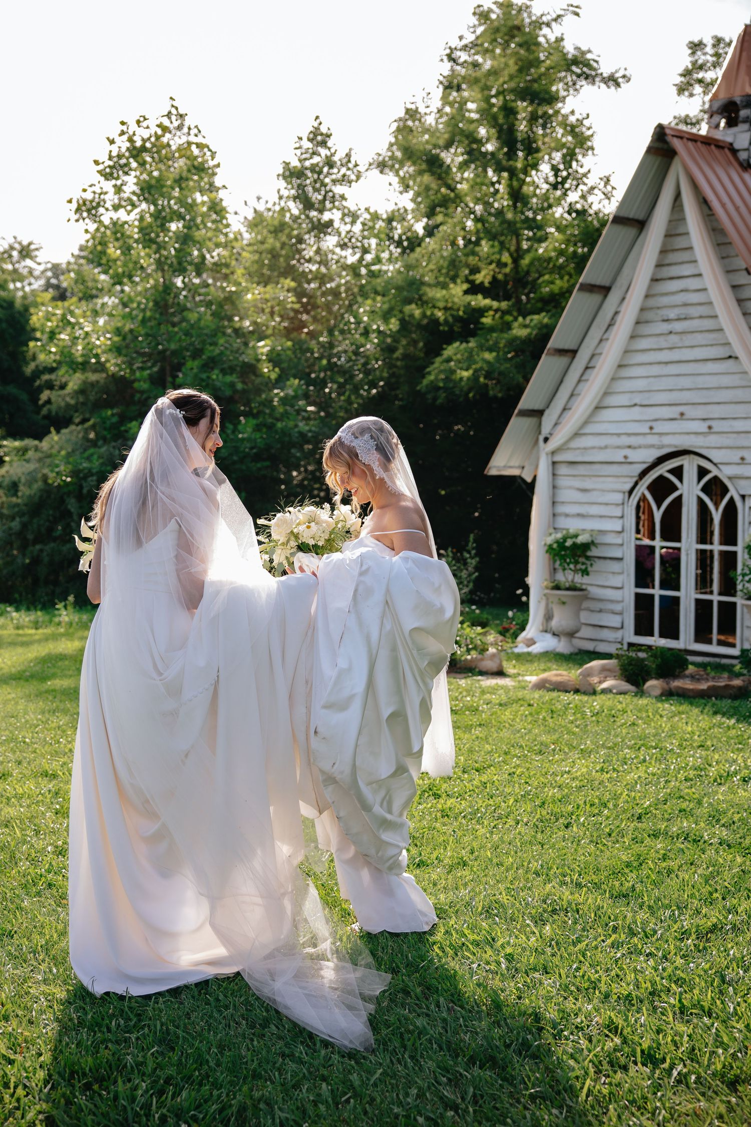 Outdoor wedding sequence shows couple dancing and twirling against backdrop of white chapel with arched gothic windows.