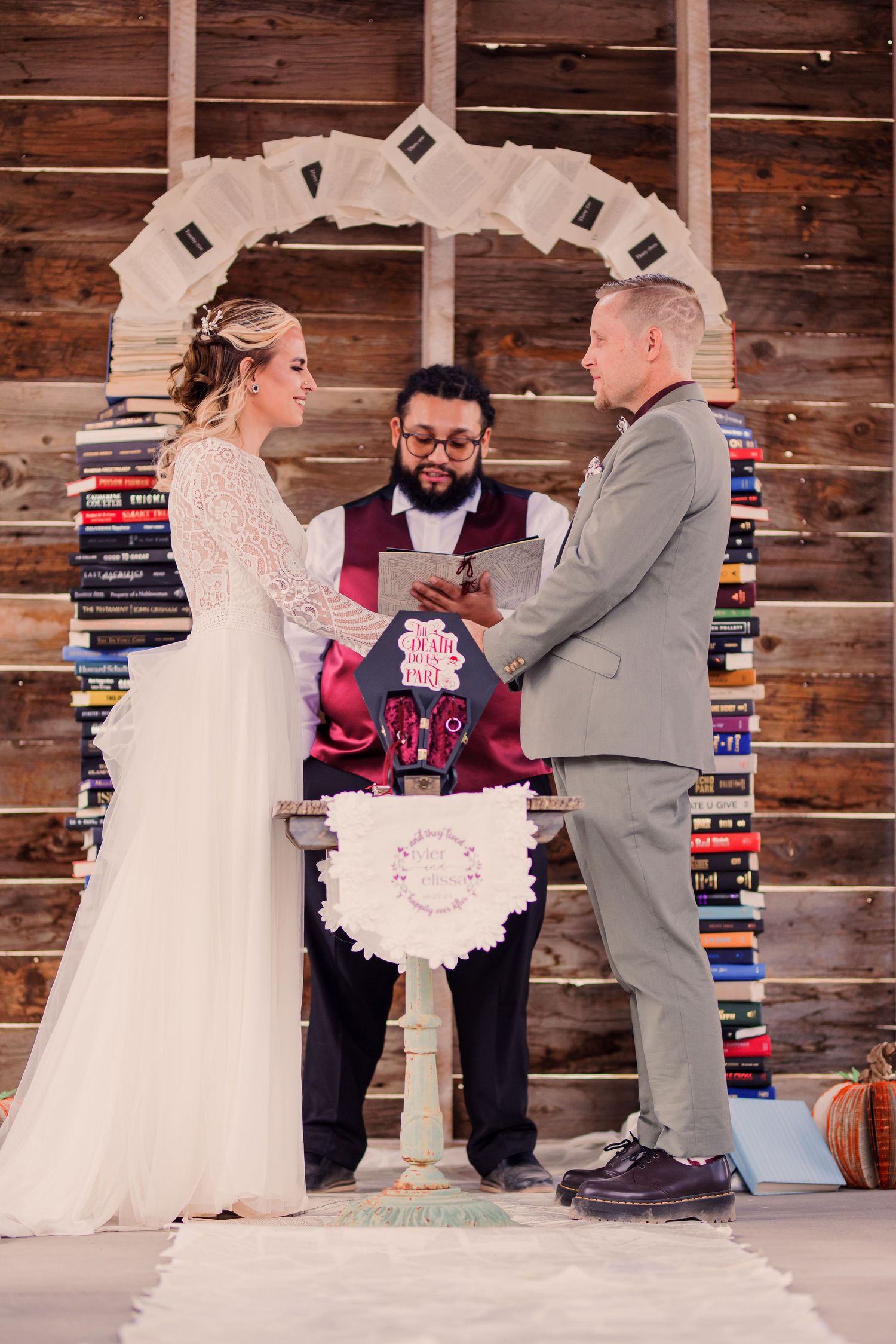 A wedding ceremony takes place in front of a rustic wooden wall with bookshelves, captured in a sequence of moments.