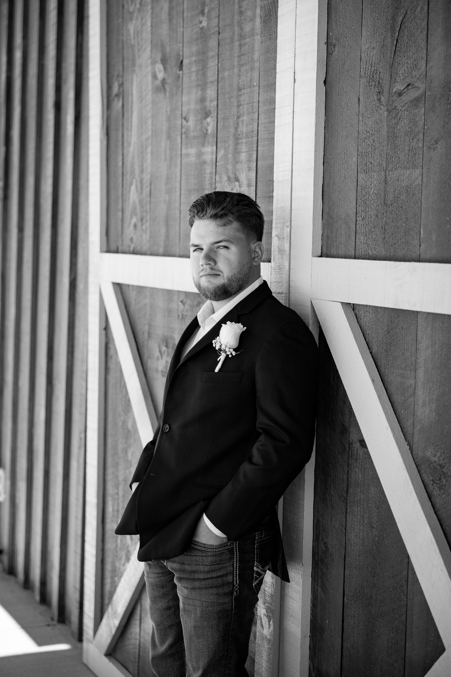 Black and white portrait of a groom at the Old Barns at Dry Run Farms.