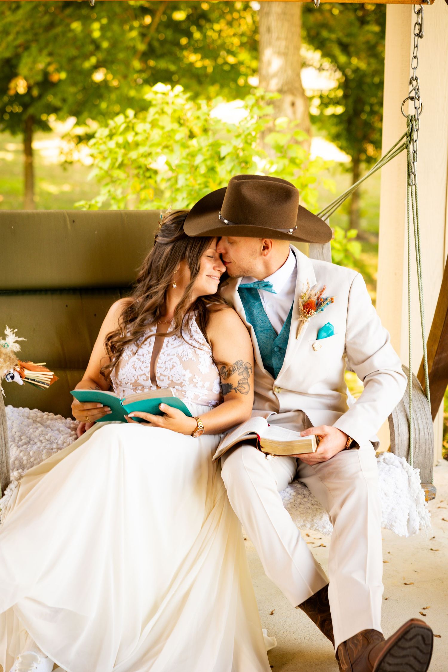 A romantic couple shares tender moments while sitting on a porch swing in a series of intimate wedding photos at Harvest Adventures.