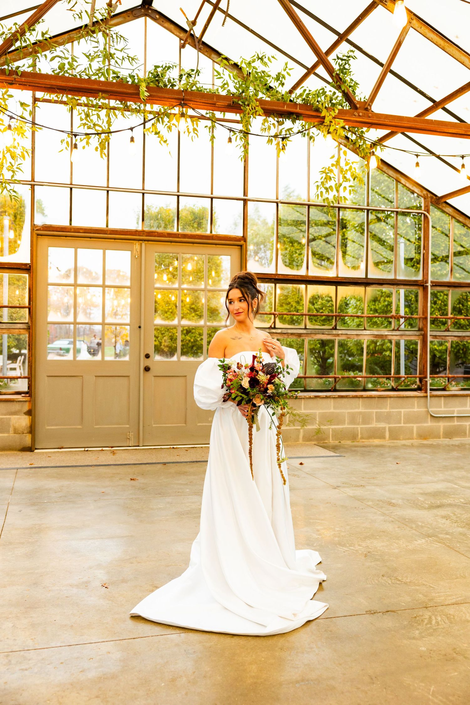 A bride in a flowing white wedding dress at Jorgenson Farms.