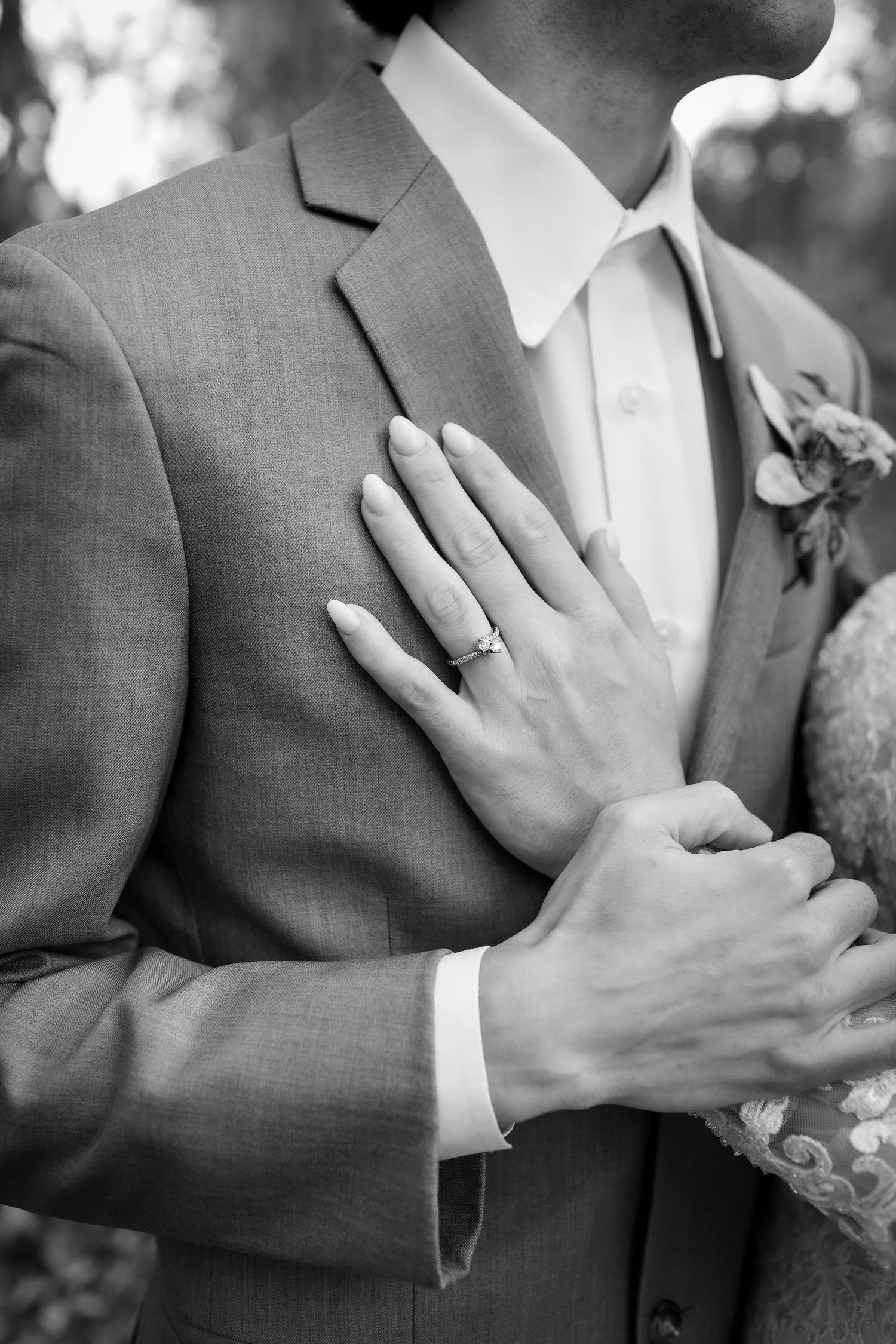 Black and white close-up series of hands with wedding rings showing tender moments during a wedding ceremony.