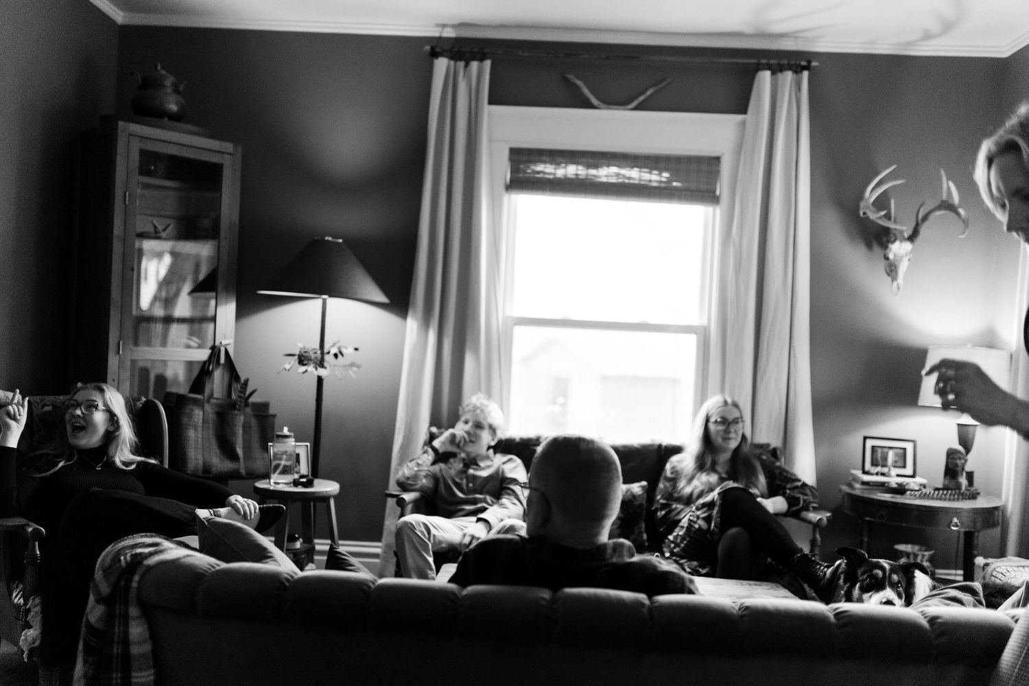 A series of black and white photographs showing various interior scenes in a home.