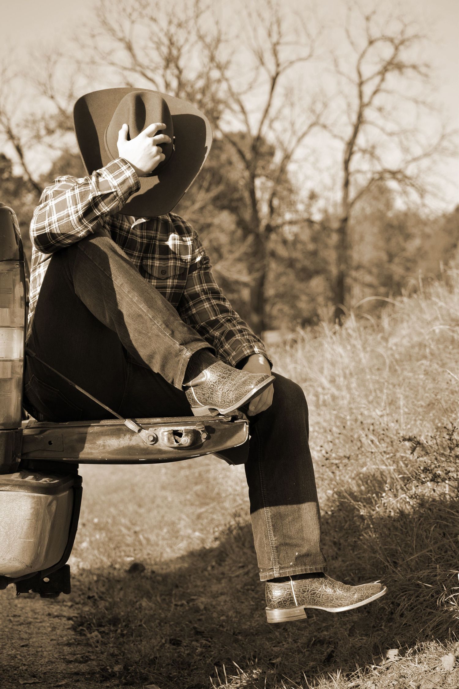 Vintage-style sepia photos showing boots and plaid clothing on a rustic bench.