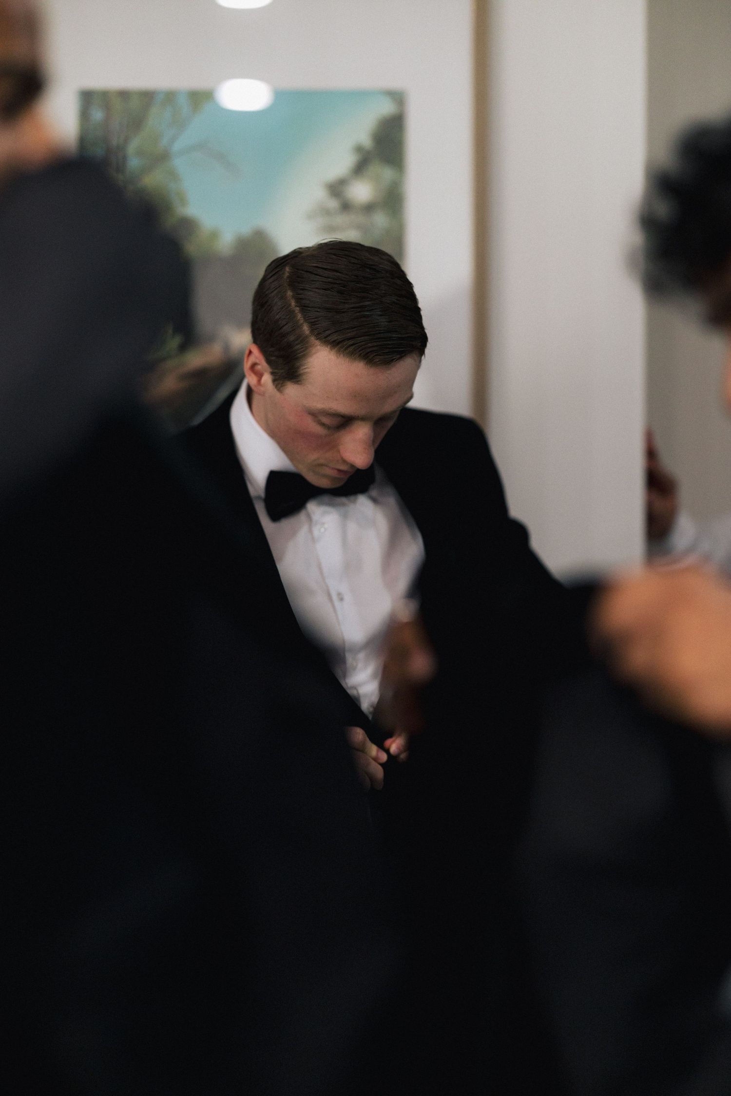 An artistic black and white photo showing formal attire in soft focus.